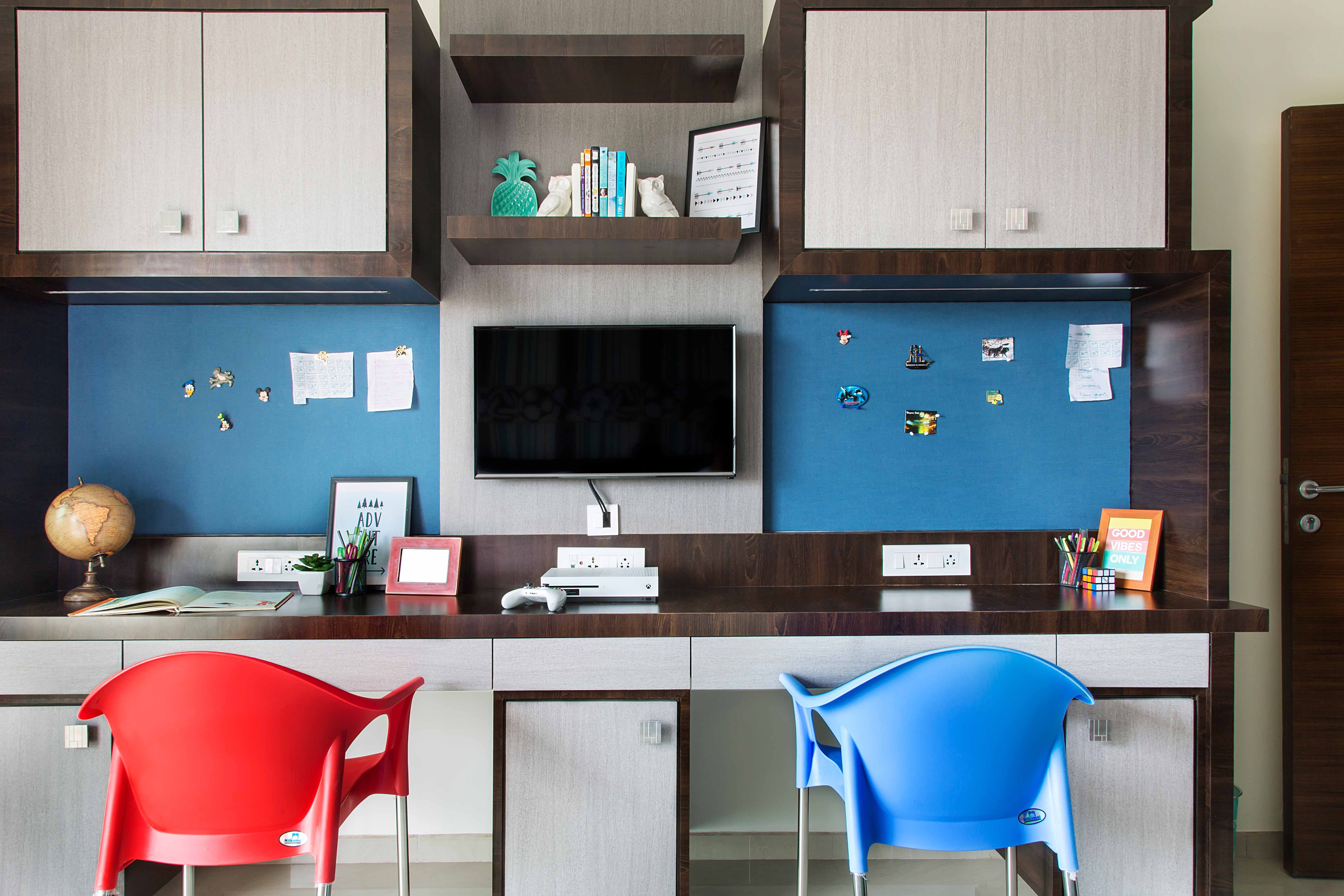 Mid-Century Modern Twin-Sharing Wooden Home Office Design With Red And Blue Accent Chairs