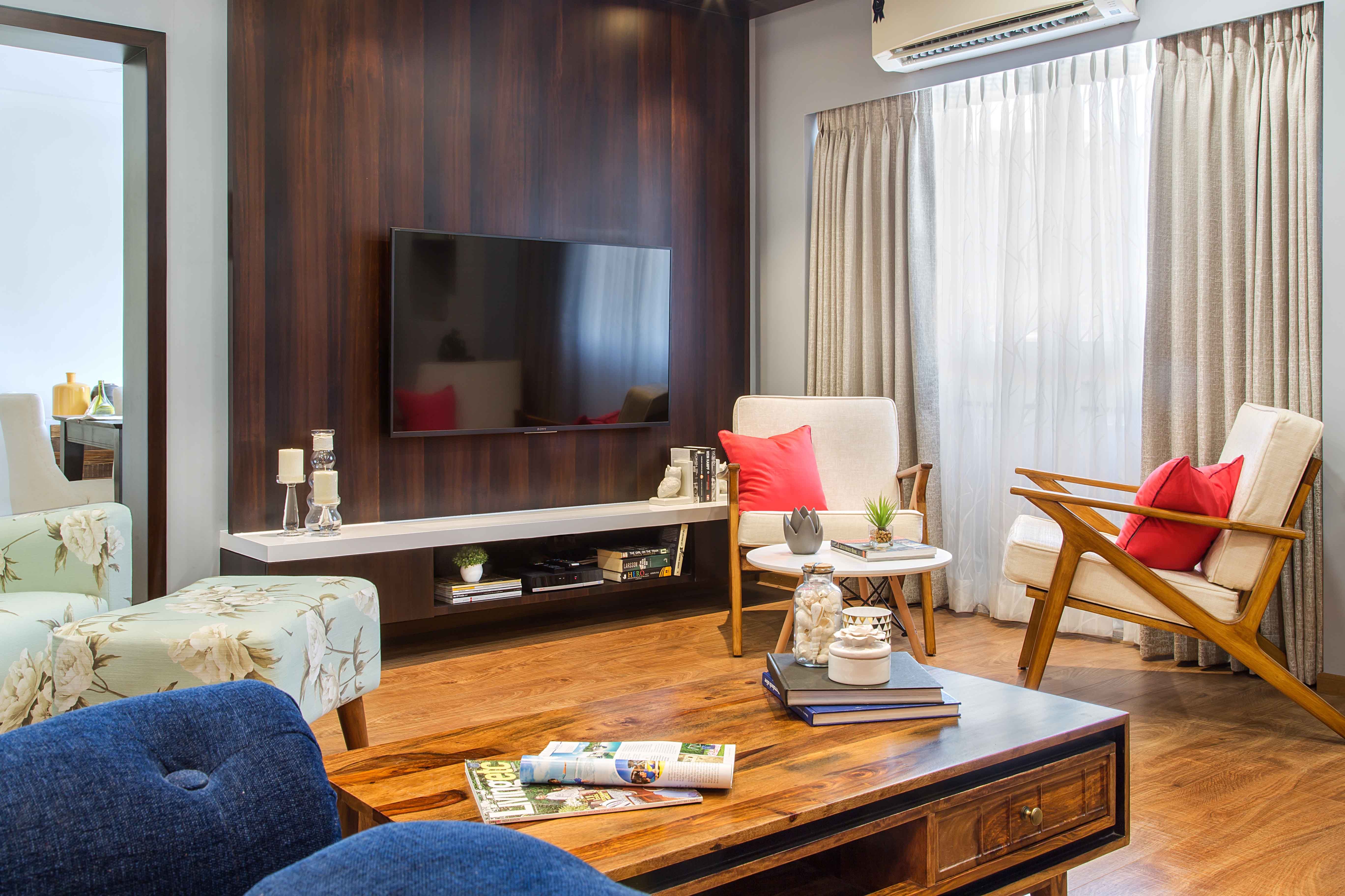 Contemporary Flat Interior Design In Mumbai With Vibrant Blue Living Room