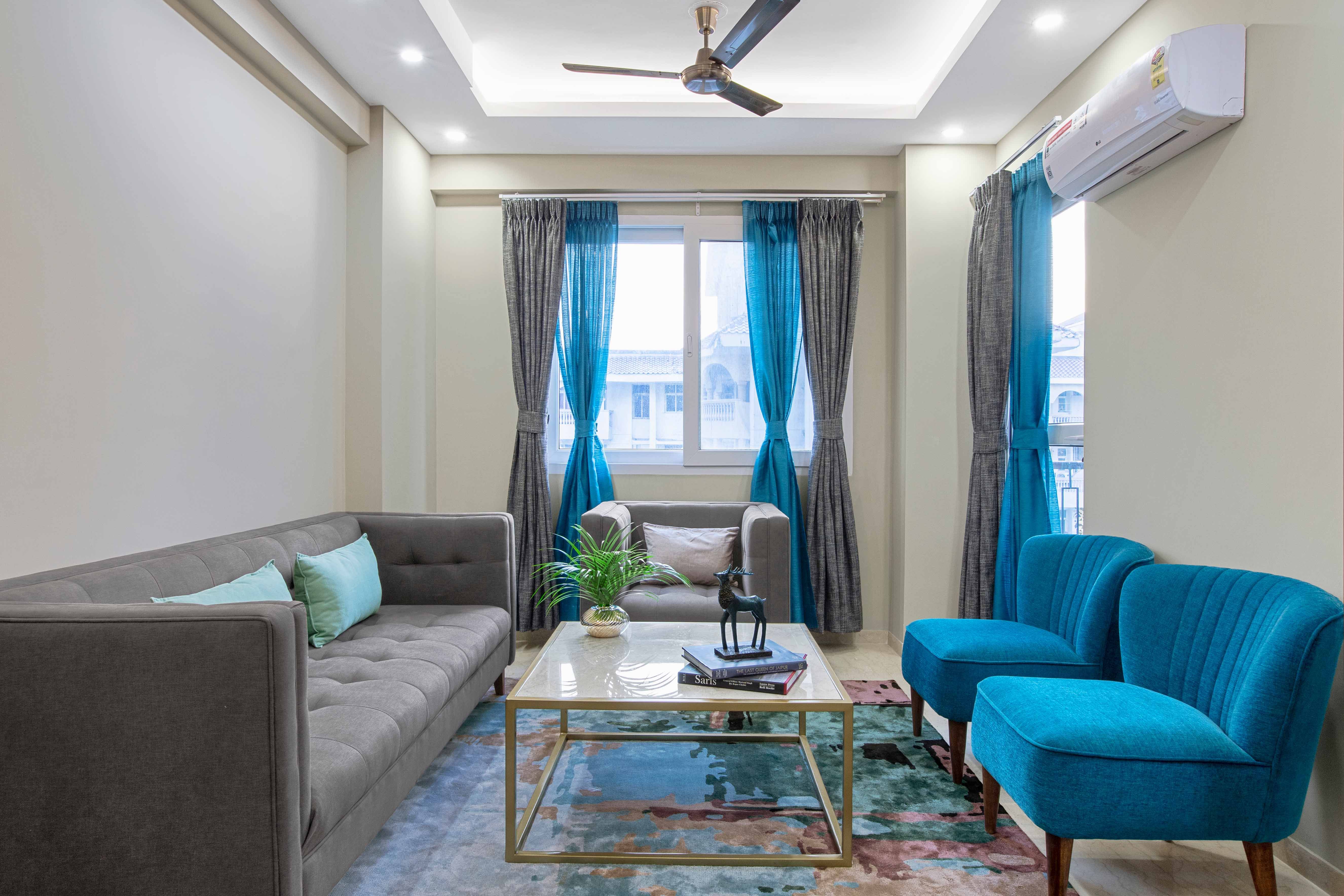 Contemporary 3-BHK Interior For Noida Flat Highlighted By Blue Accents ...