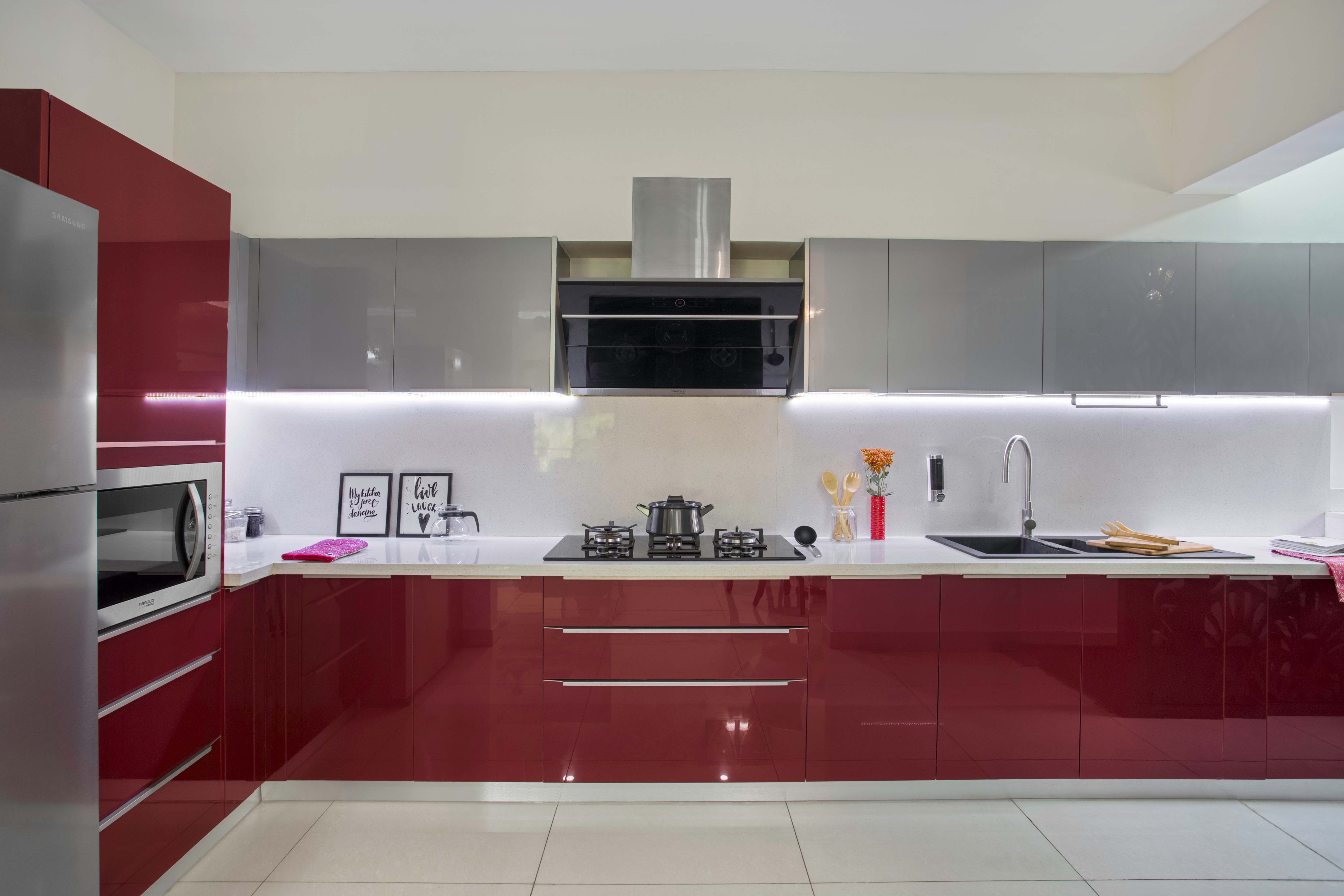 Contemporary Glossy Modular L-Shaped Kitchen Design With Red And Silver Cabinets