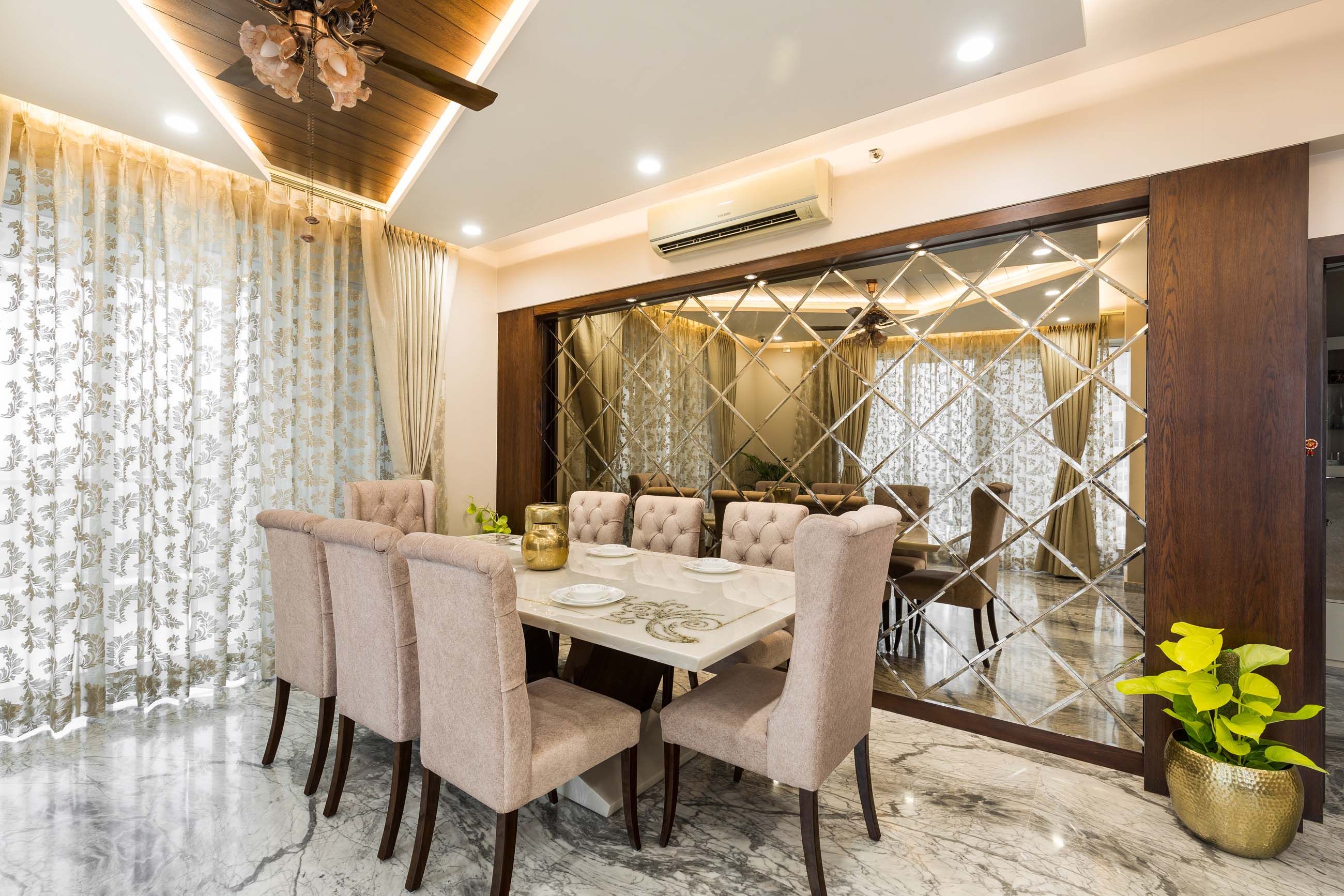 Modern 8-Seater White And Beige Dining Room Design With Bevelled Mirrored Accent Wall