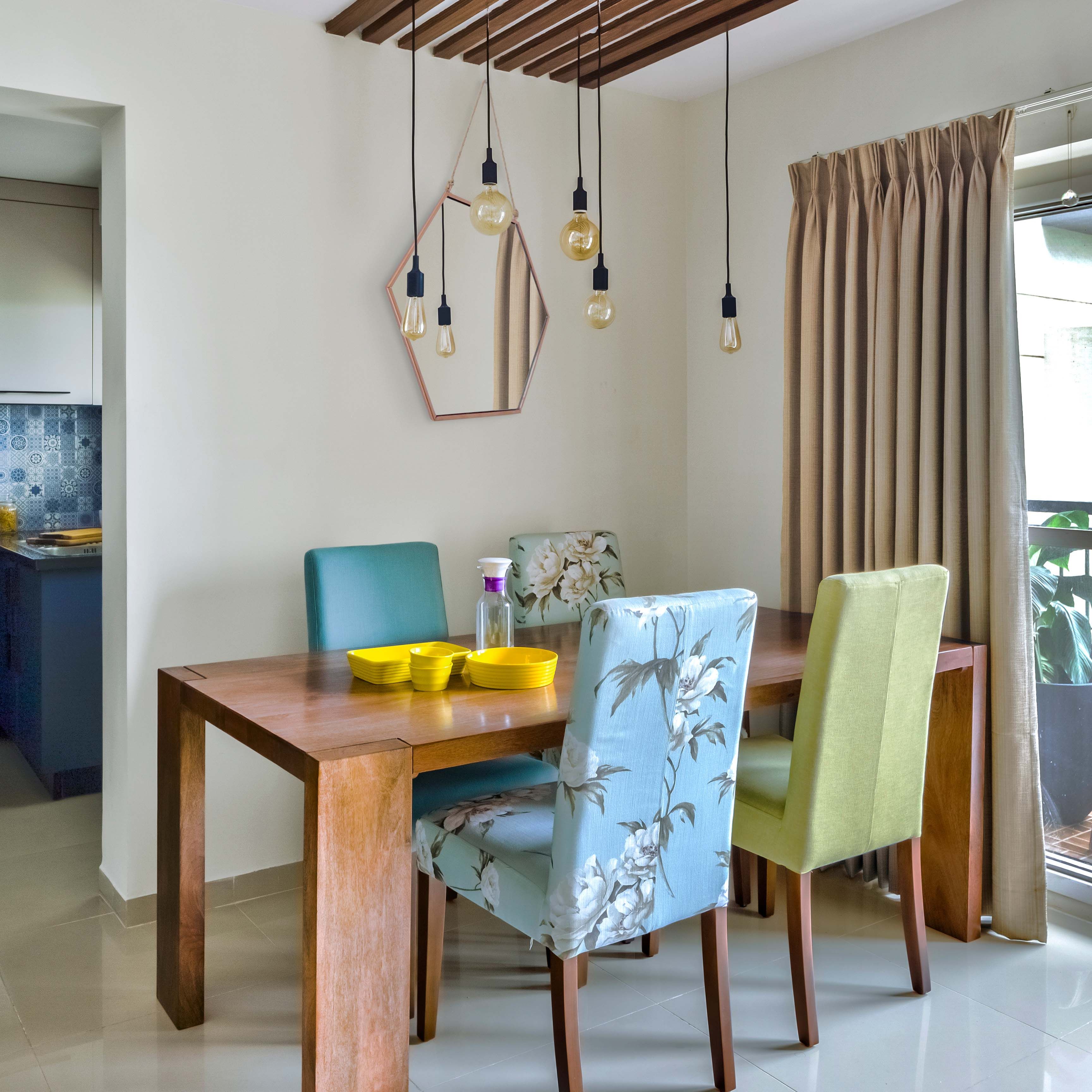 Contemporary Wooden 4-Seater Dining Room Design With Green And Blue Patterned Chairs