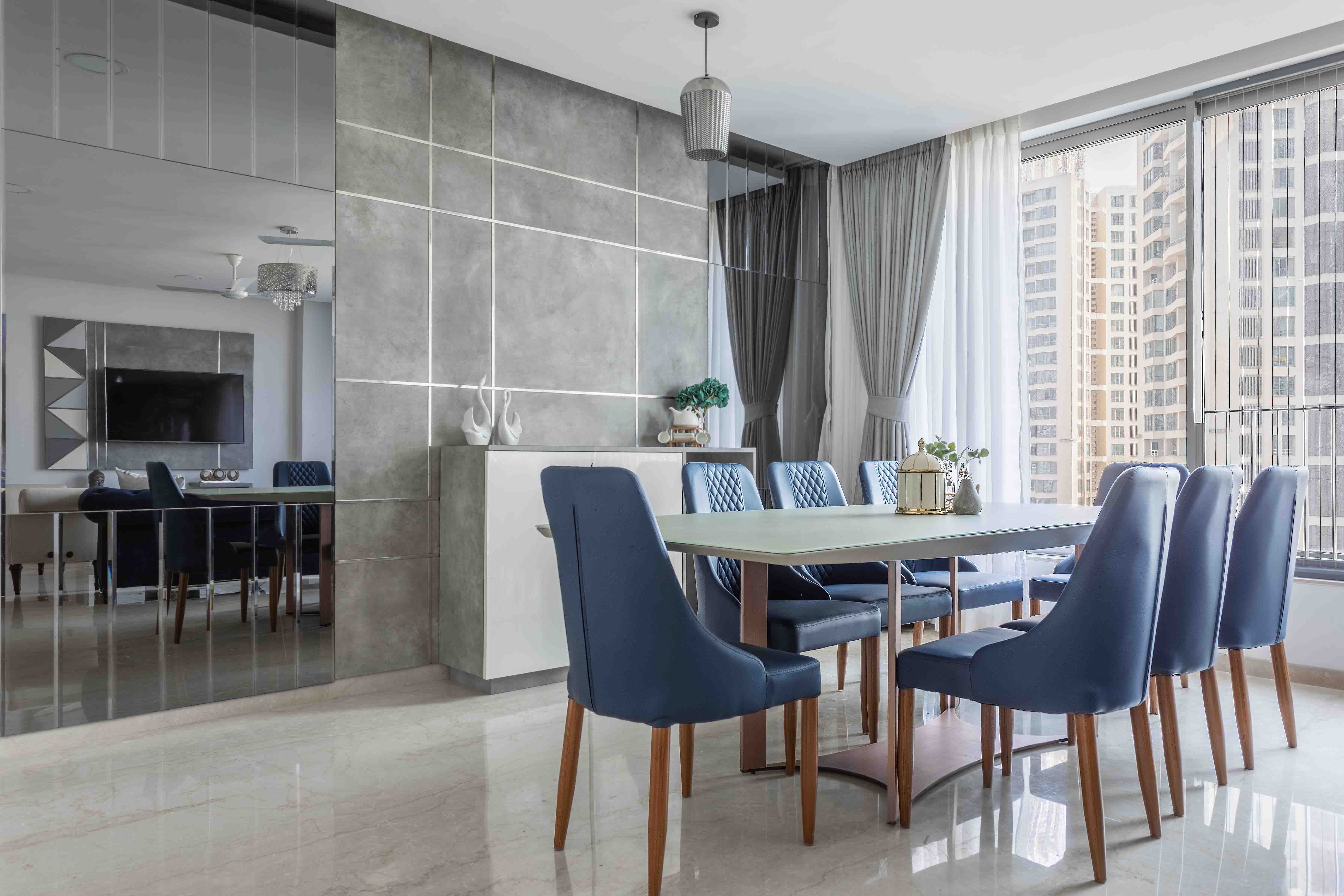 8-Seater Blue And White Dining Room Design With Grey Accent Wall | Livspace