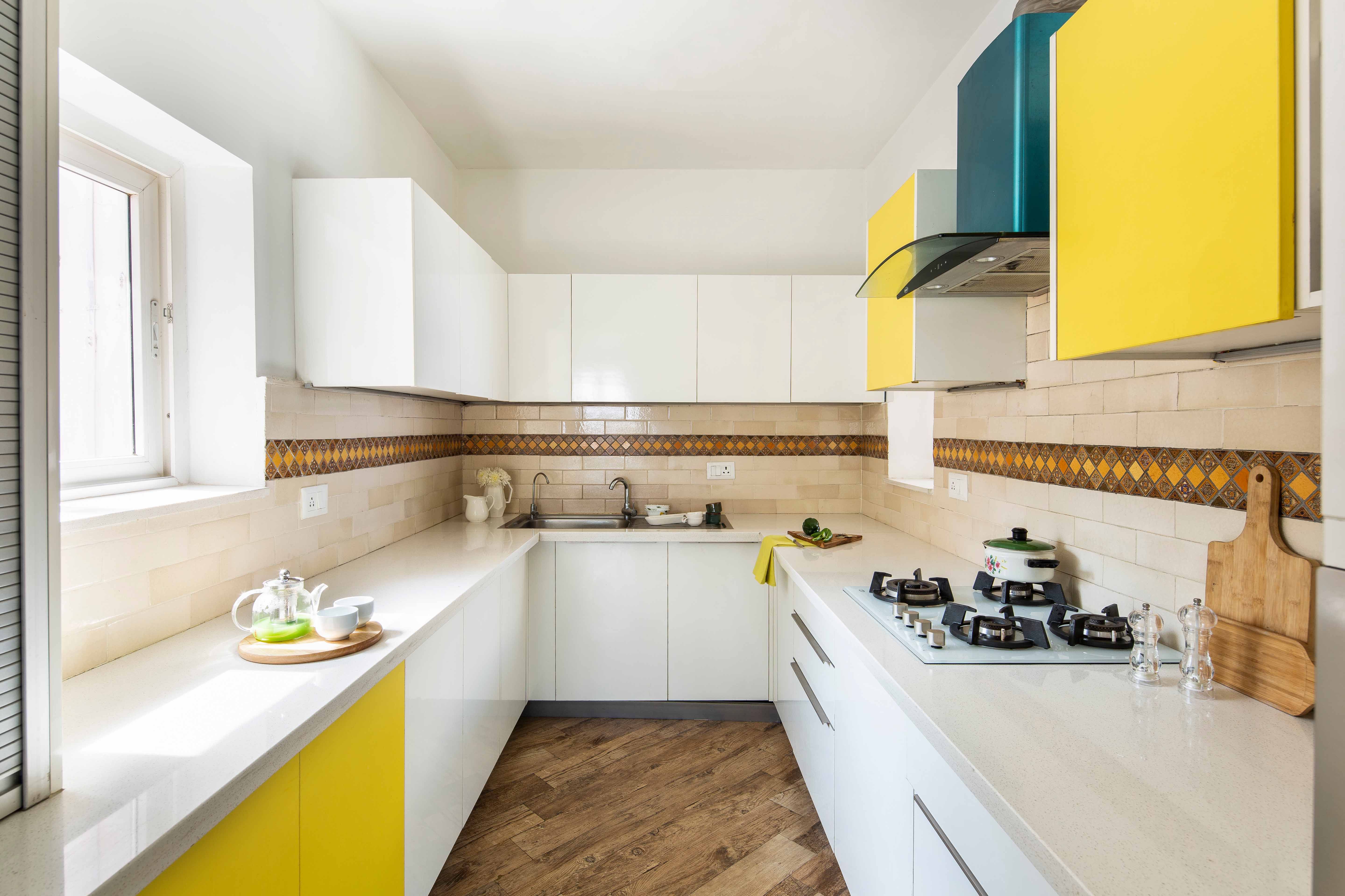 Modern Modular U-Shaped Kitchen Design In Frosty White And Marigold Yellow