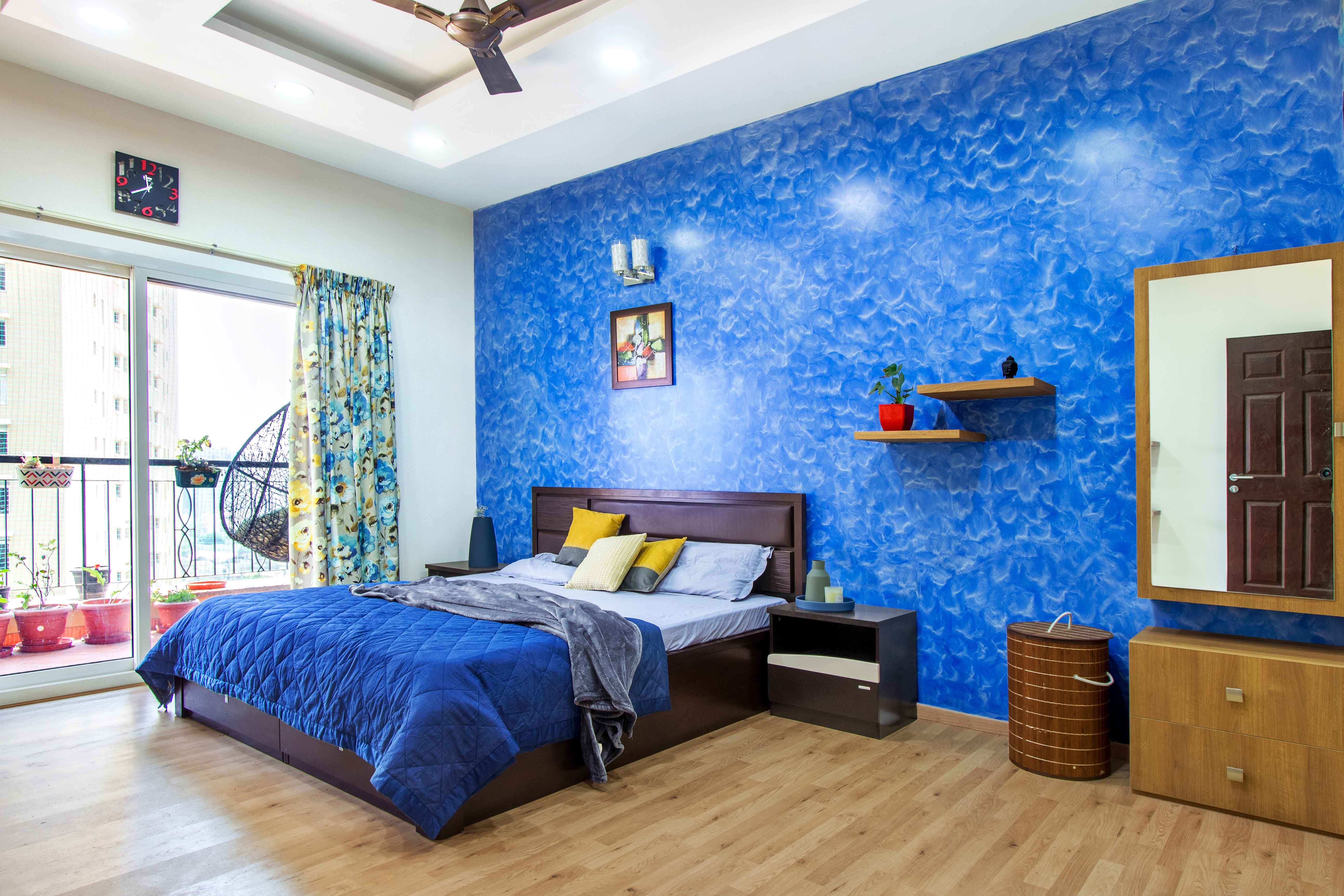 Classic Master Bedroom Design With Textured Bright Blue Accent Wall