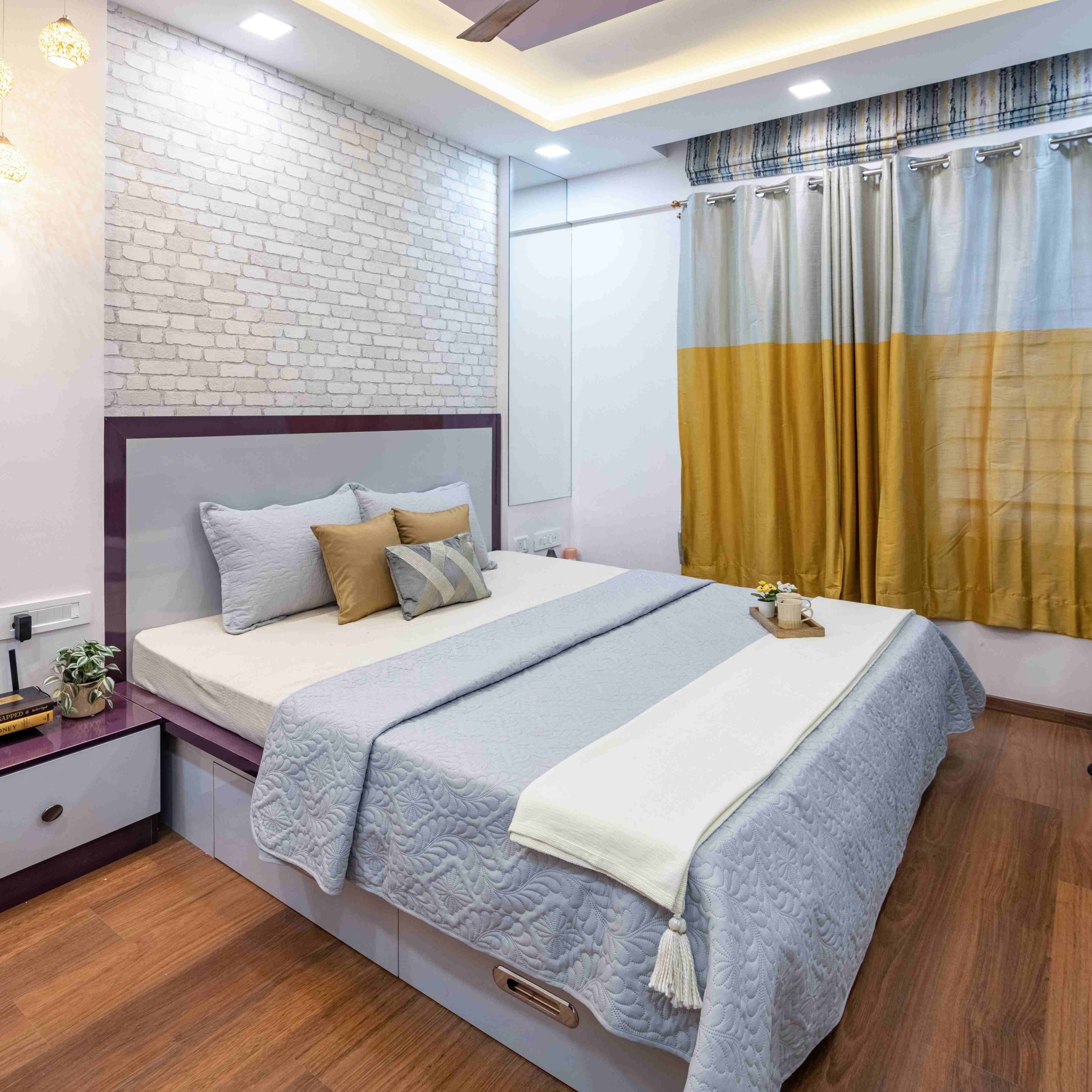 Modern Bedroom Design With A Queen Size Bed And White And Purple Side Tables