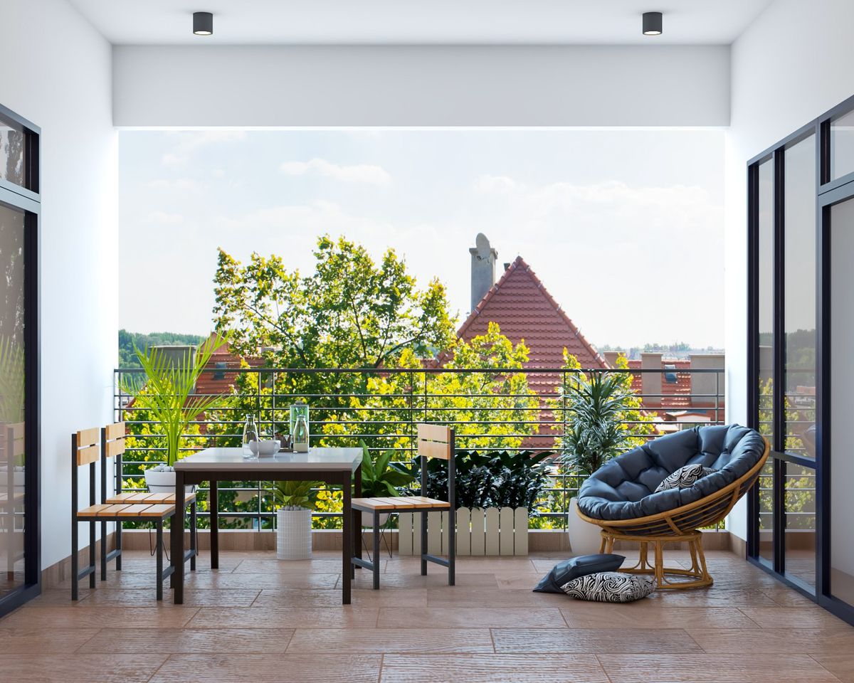 Balcony Design With Rattan Accent Chair And Wooden Flooring | Livspace