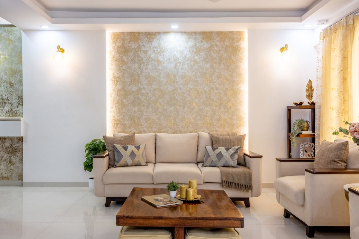Spacious Living Room Design With Cove Lights And Indoor Plants | Livspace