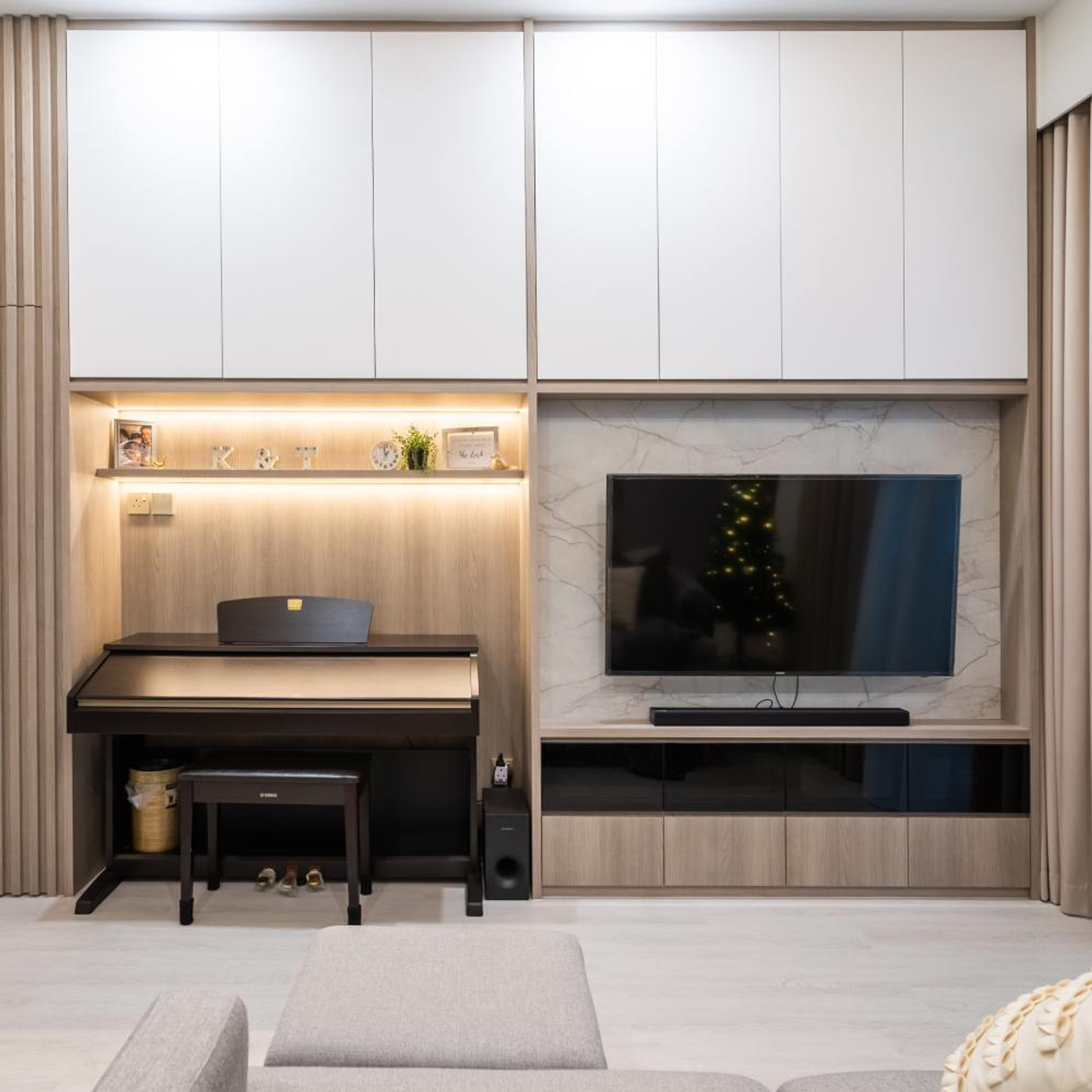 WallMounted TV Design With A Beige Marble Backdrop Livspace