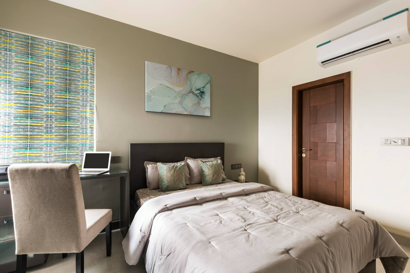 Spacious Guest Room Design With Dark Beige Accent Wall Livspace