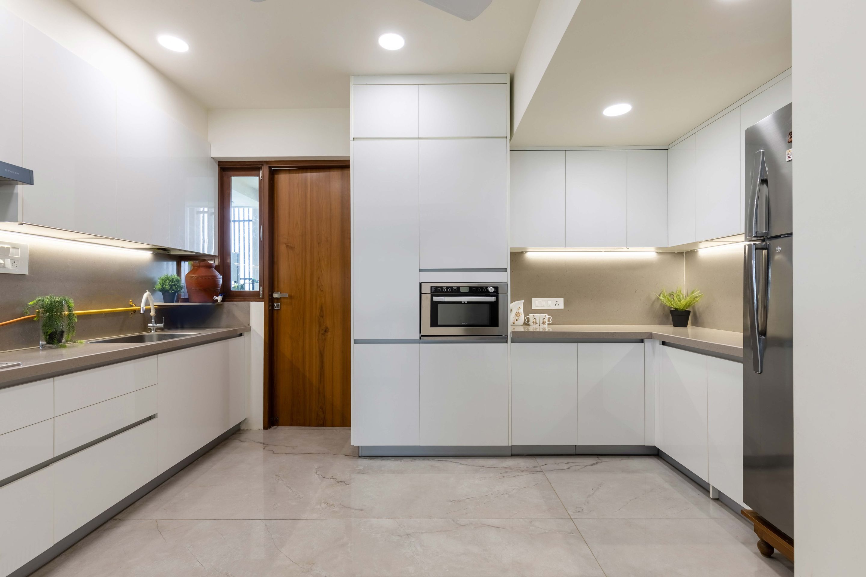 Spacious Kitchen Design With Profile Lighting | Livspace