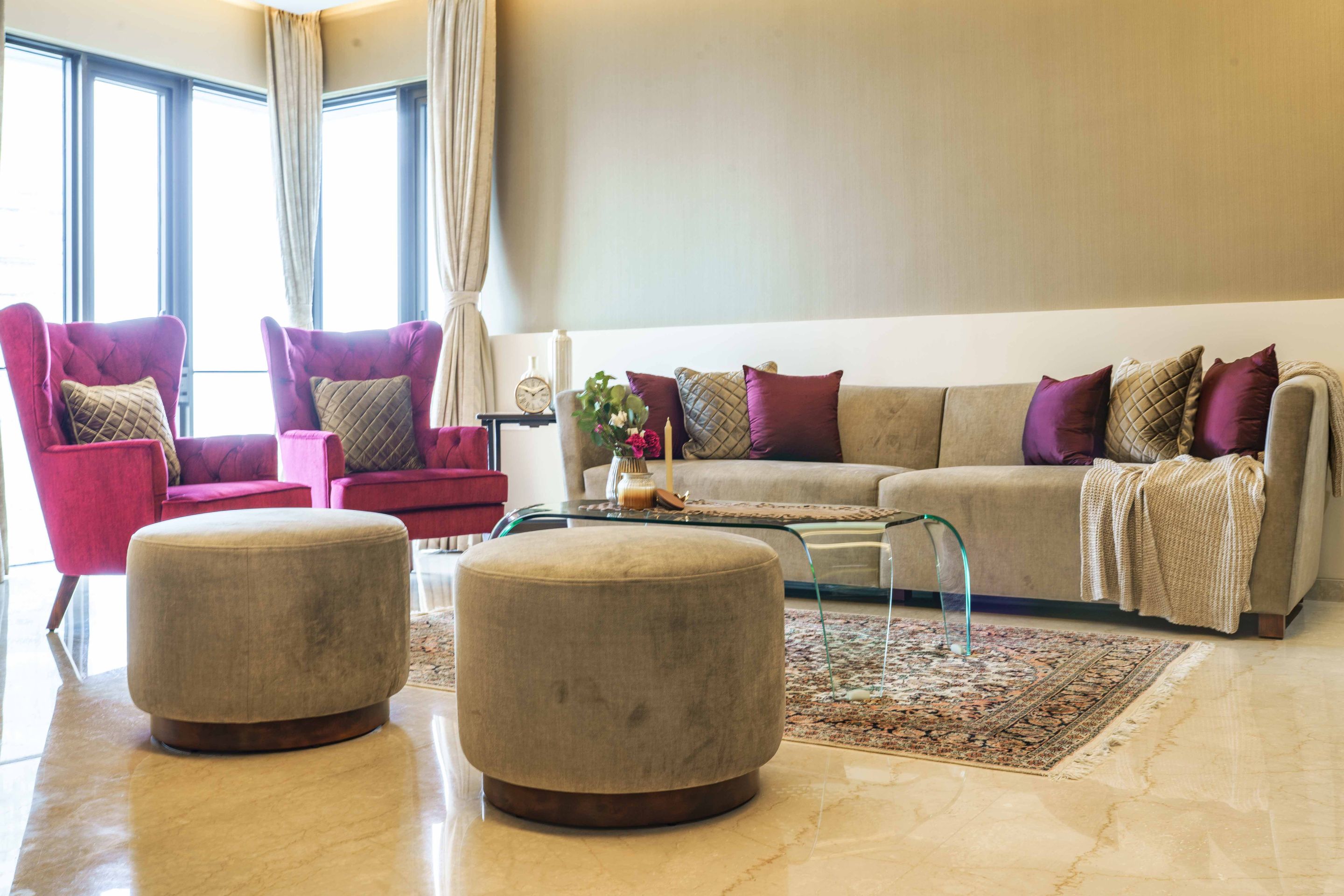 Spacious Living Room Design With Beige Sofa And Magenta Accent Chairs ...