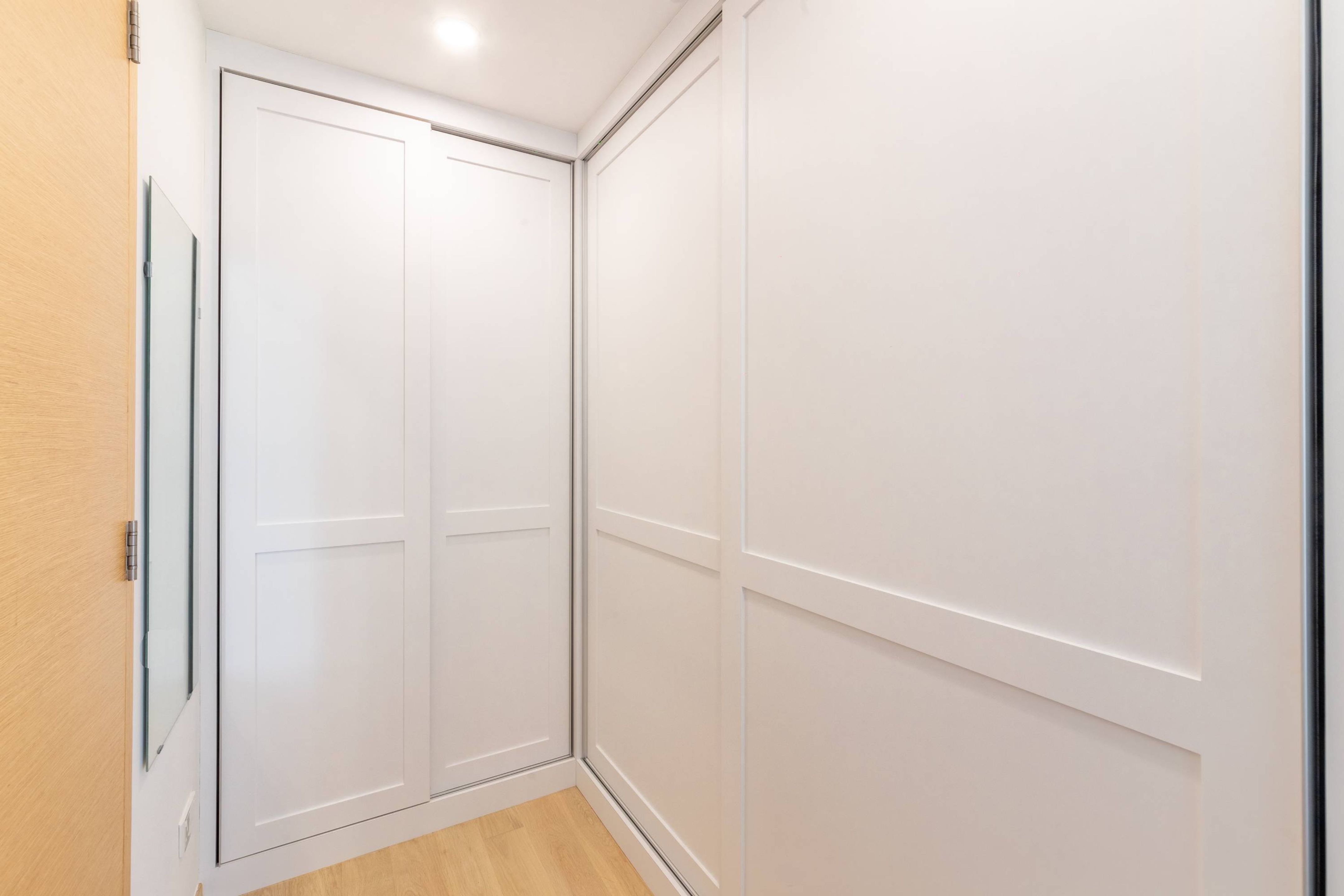 Sliding Wardrobe Design With A Laminate Finish | Livspace