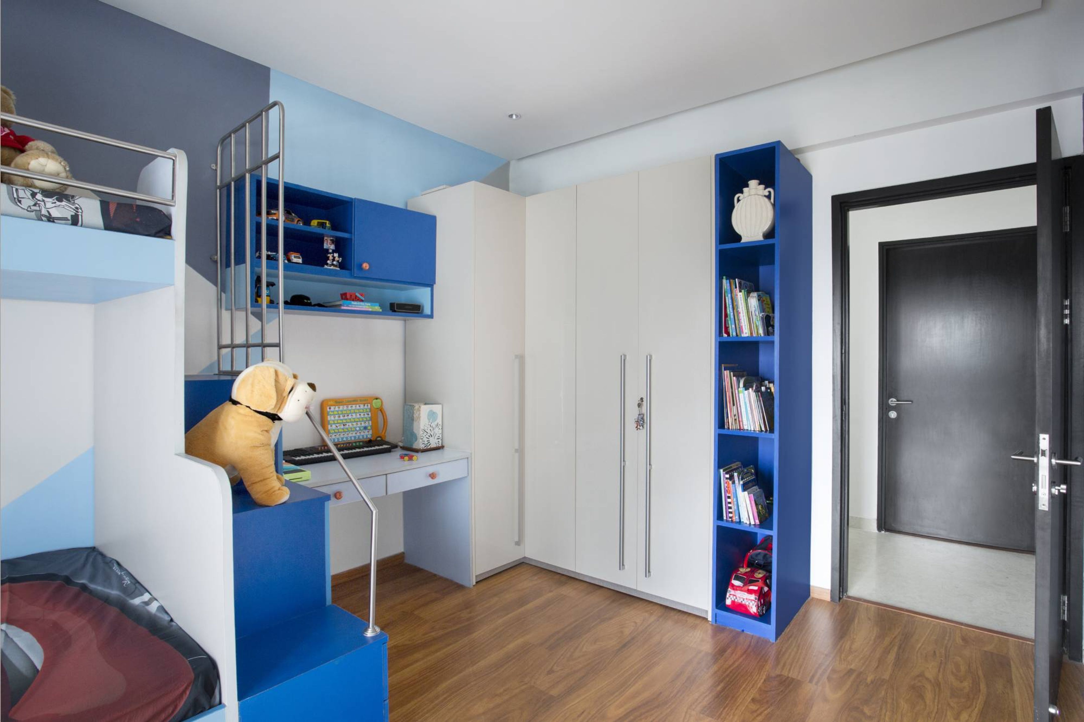 Compact Kid's Bedroom Design With An L-Shaped Wardrobe | Livspace