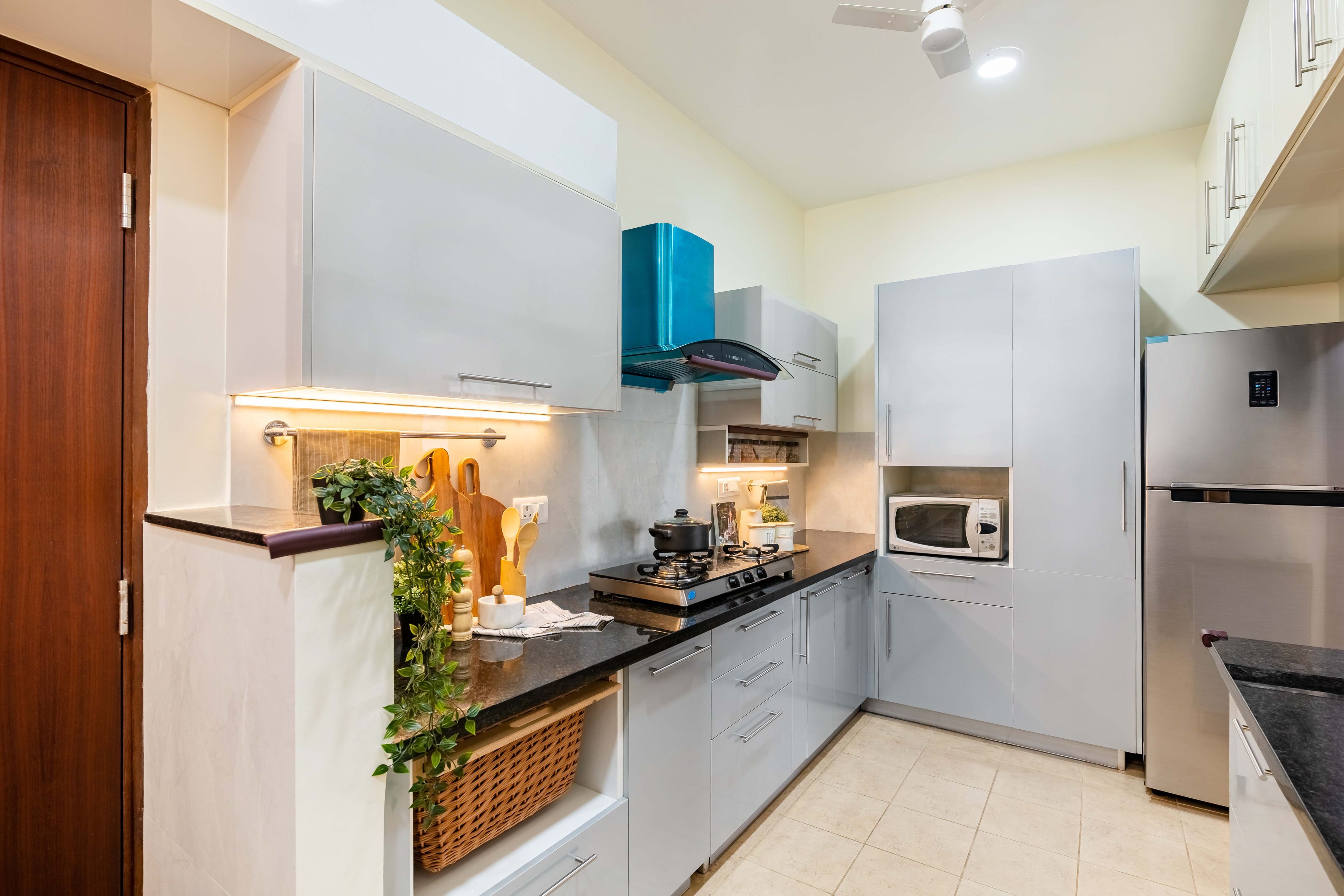 Grey And White Spacious Modular Kitchen Design | Livspace