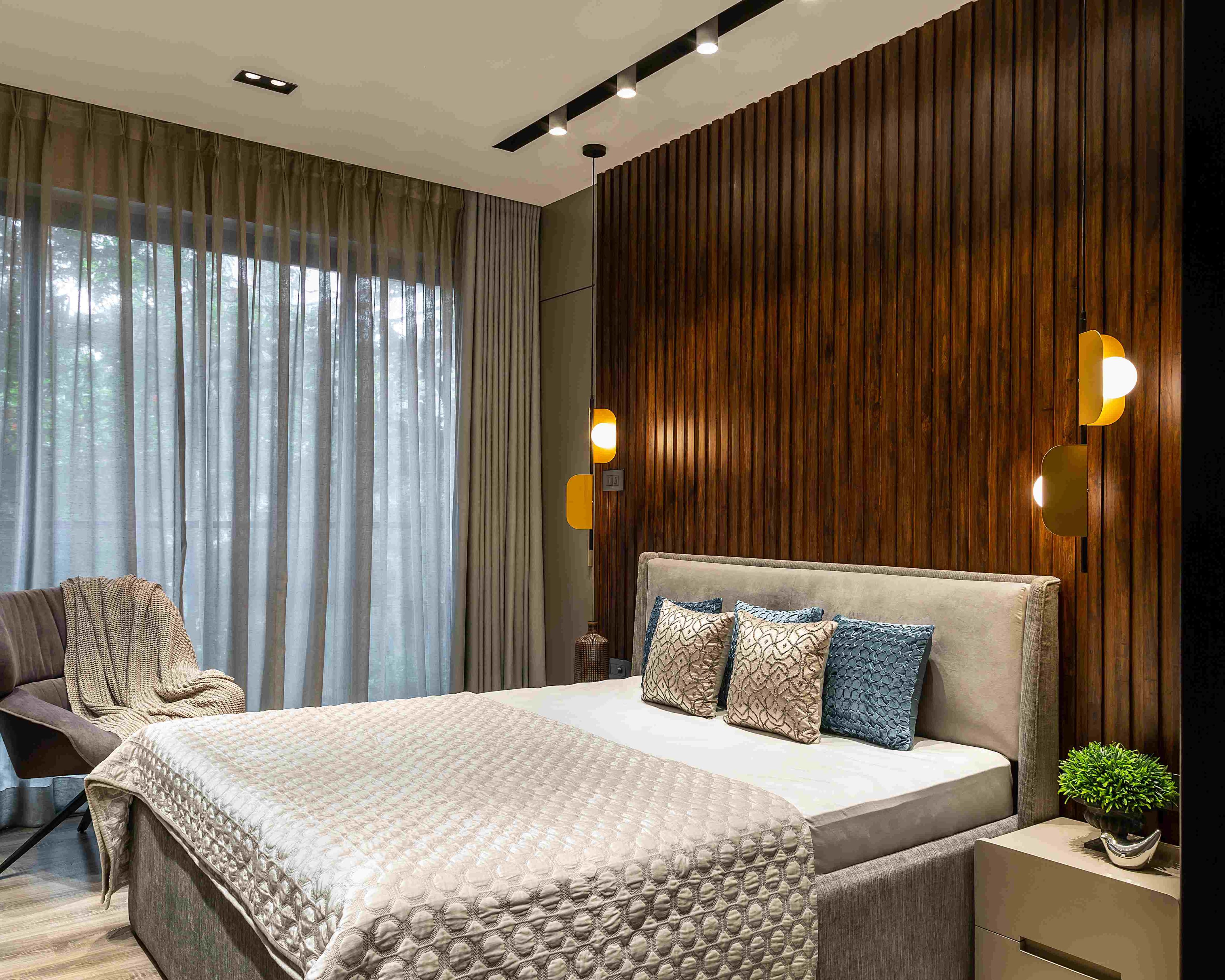 Bedroom Wall Design With Wooden Panelling And Light Fixtures | Livspace