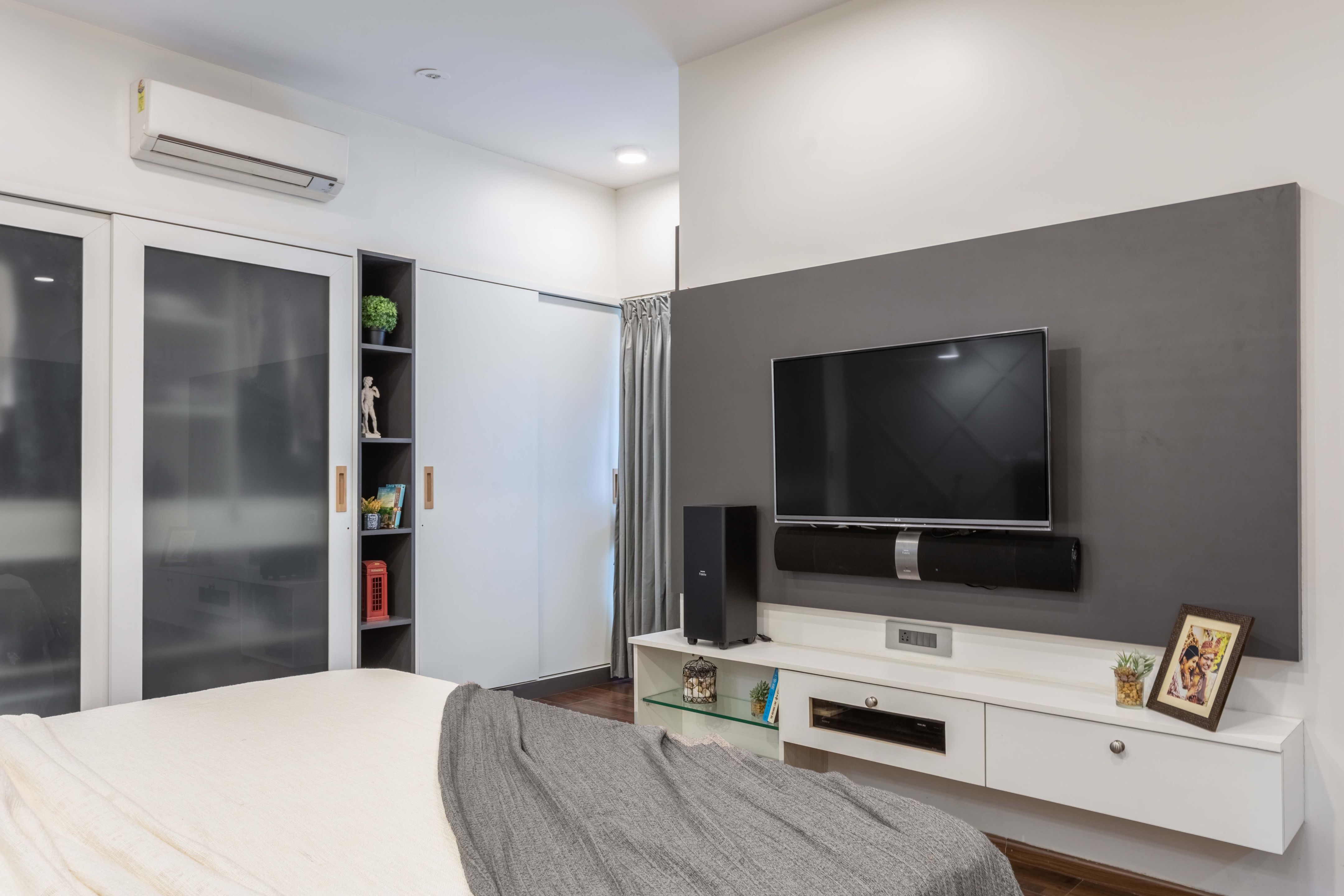 Master Bedroom Design With Grey Accent Wall | Livspace