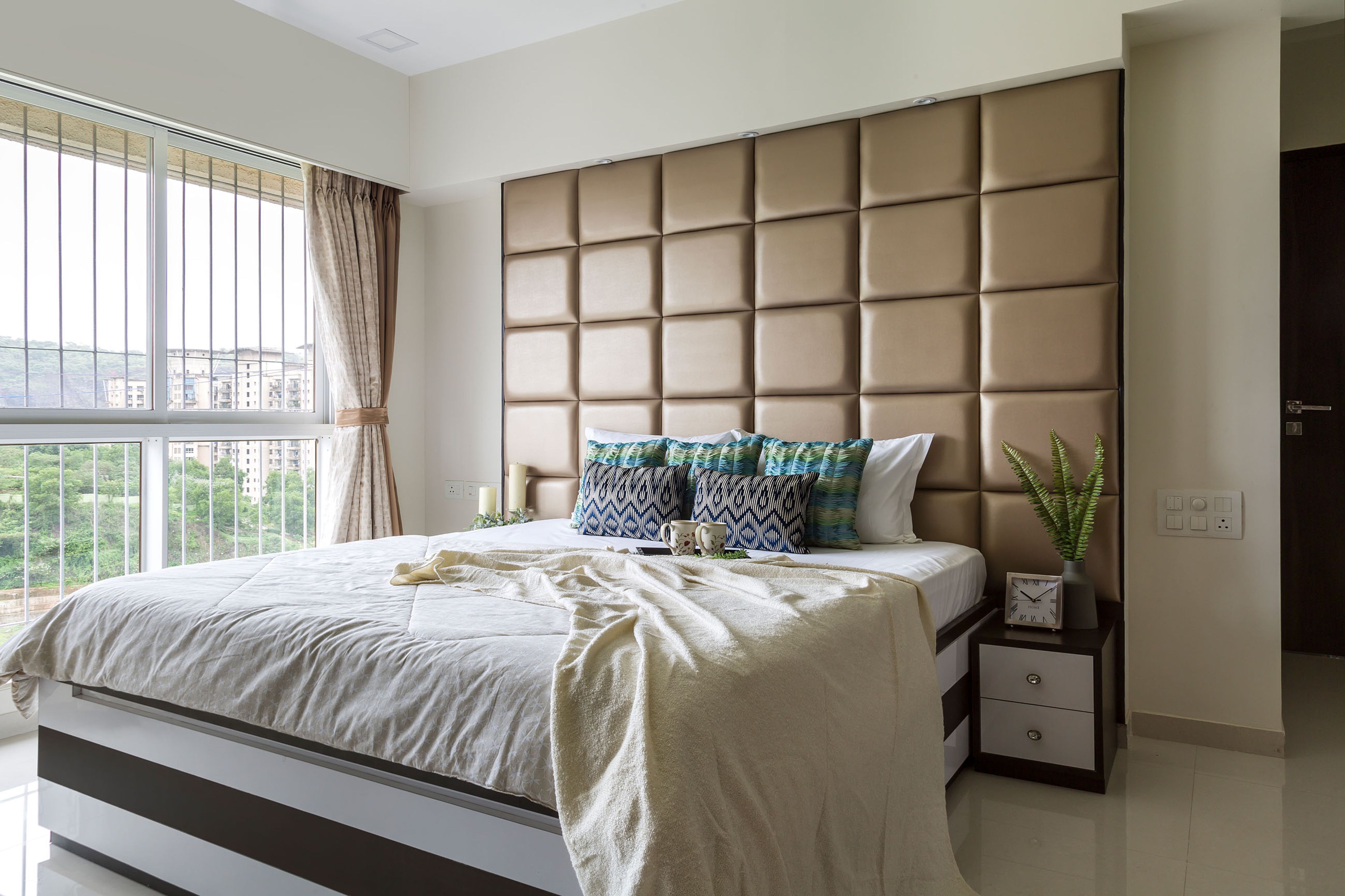 Master Bedroom Design With Brown Chequered Headboard | Livspace