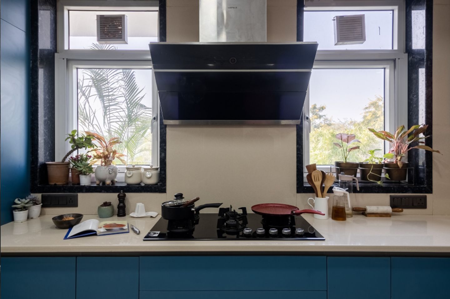 Kitchen Window Design With A Black Granite Frame | Livspace