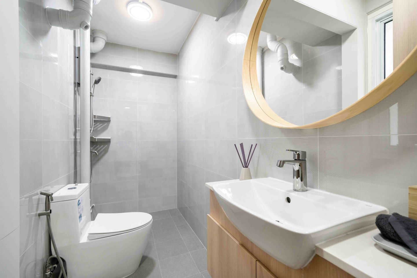 Grey Bathroom Design With A Wooden Vanity Unit - Livspace
