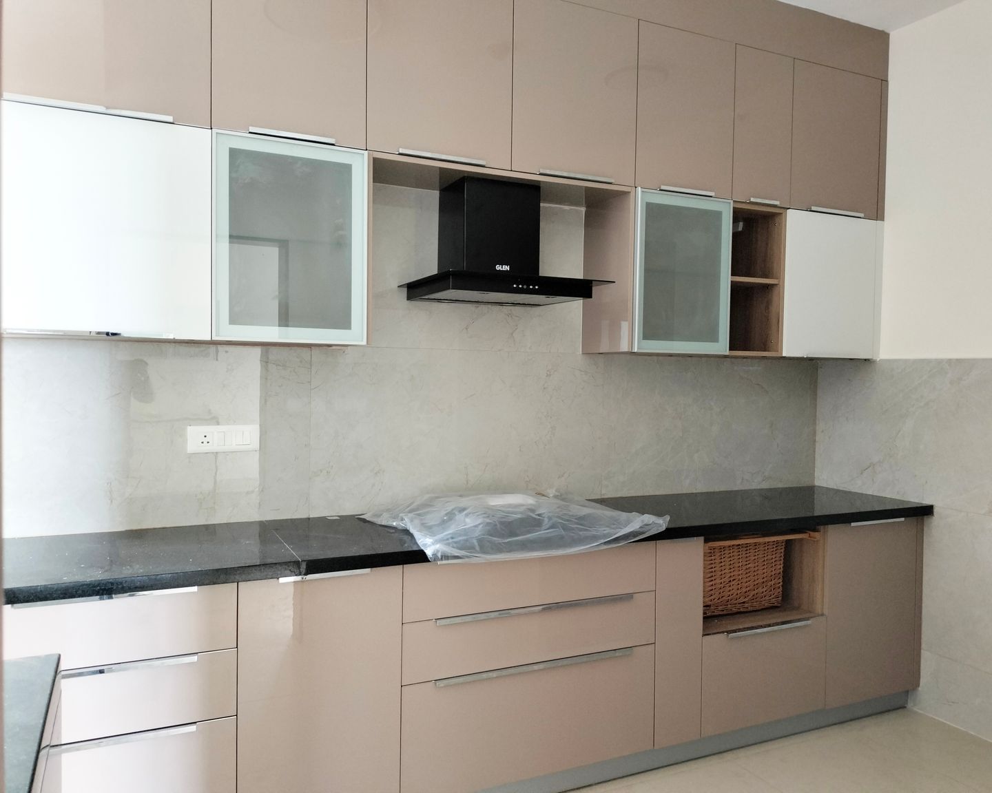 Parallel Kitchen Design with Peach Units and Marble Patterned Backsplash Tile