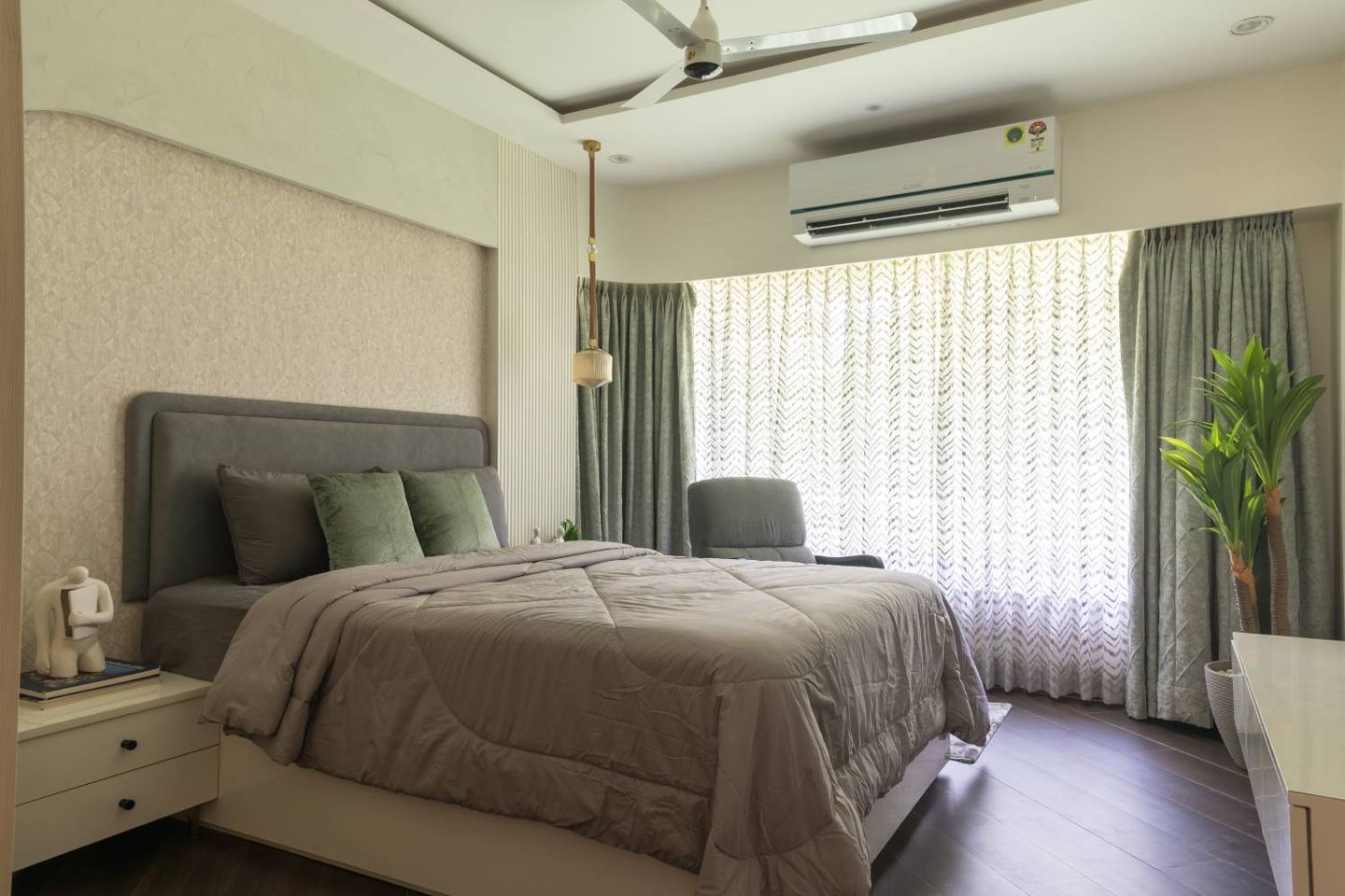 Bedroom Design with Beige Textured Wall, Grey Accent Chair and Grey Tufted Headboard Bed