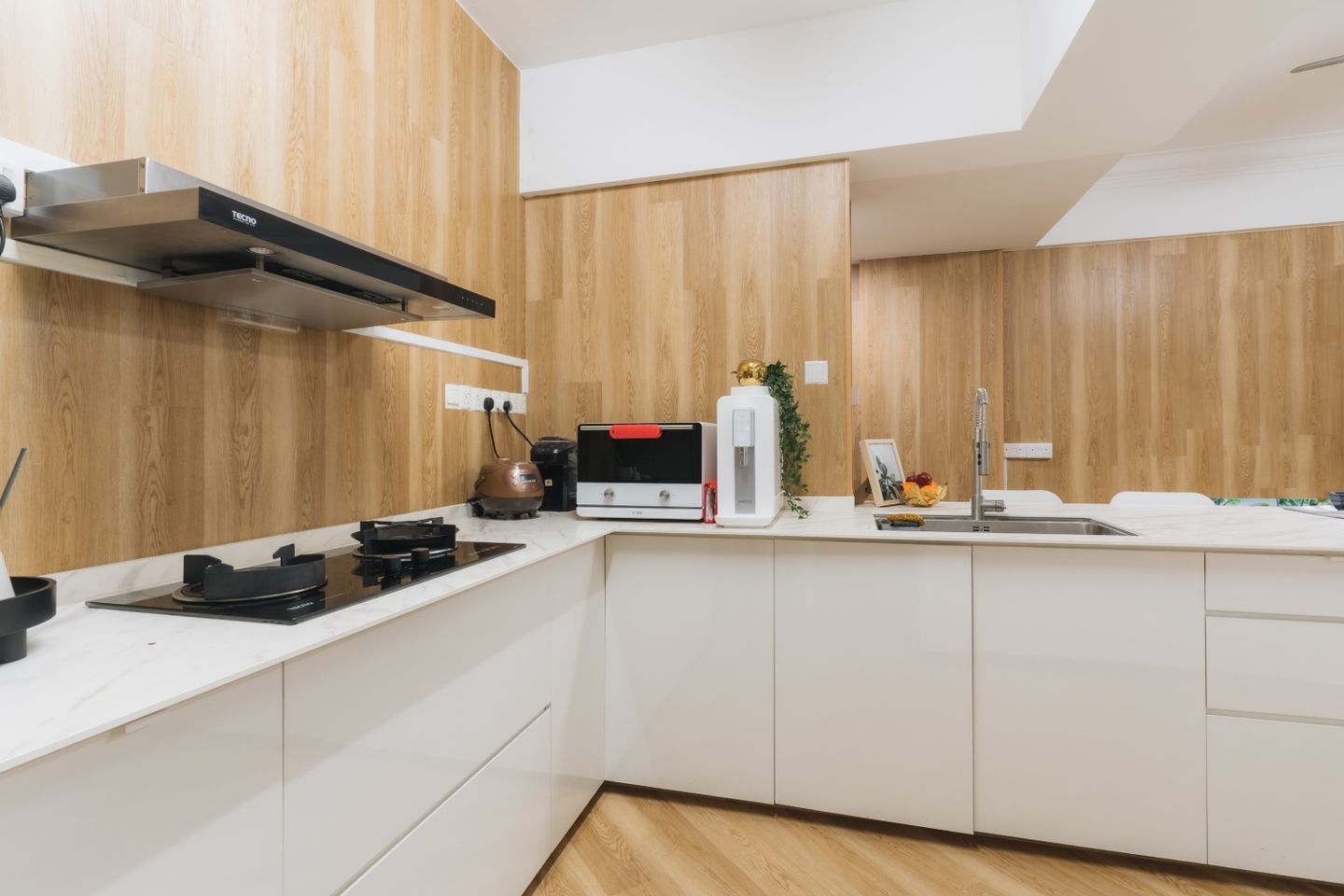 L-Shaped Kitchen Design With White Cabinets And A Quartz Countertop - Livspace