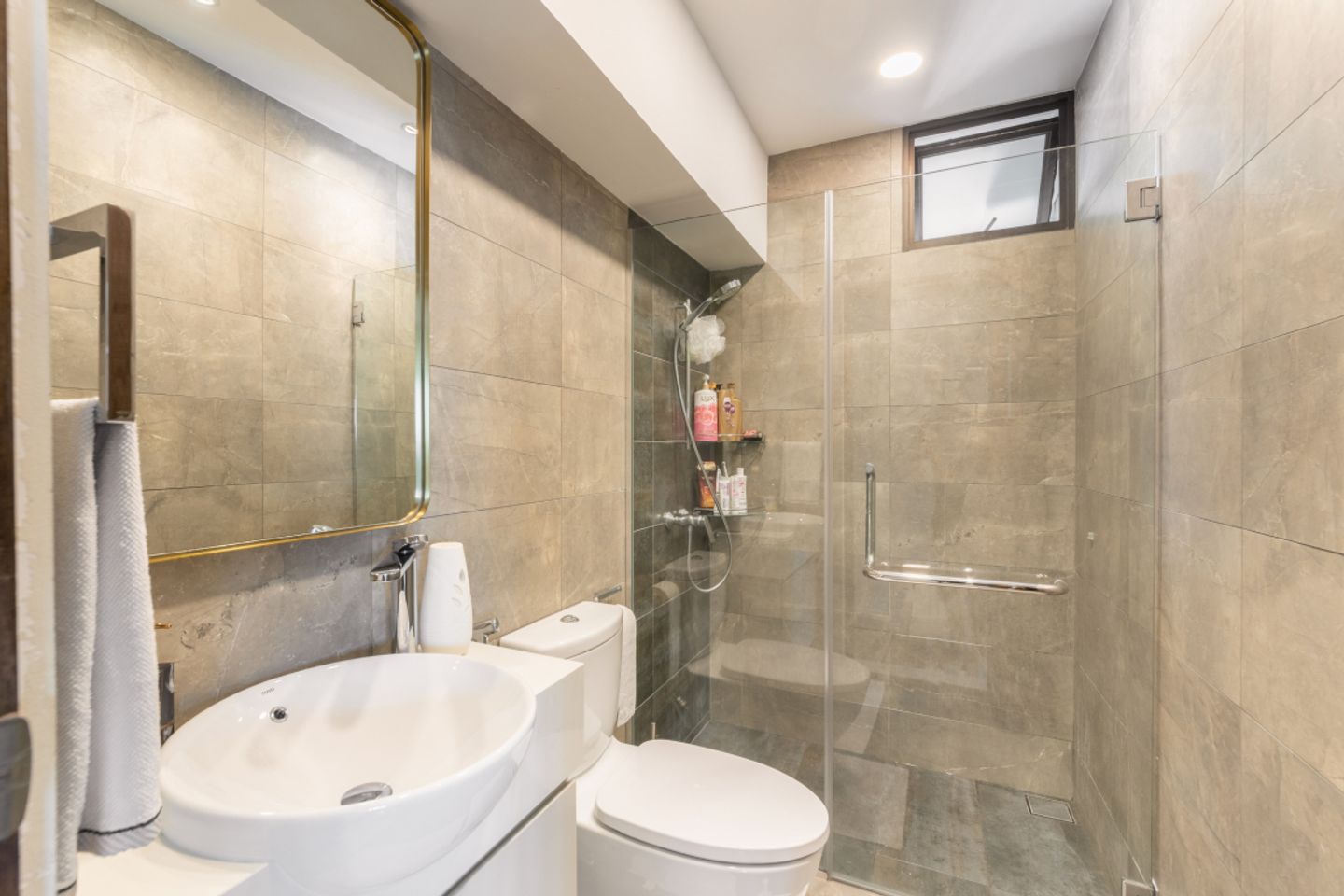 Bathroom With Dark Brown Marble Tiles - Livspace