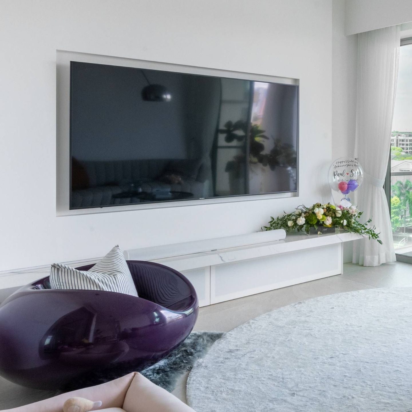 Spacious TV Cabinet Design With White Back Panelling - Livspace