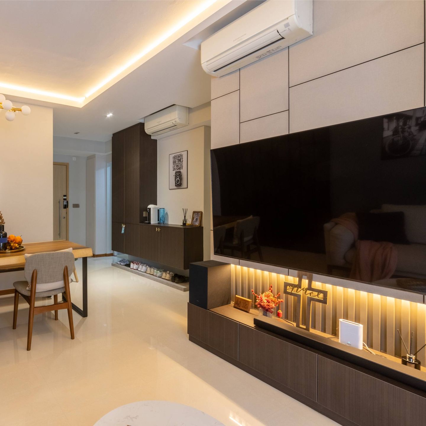 Modern TV Unit With White Back Panelling And Closed Storage
