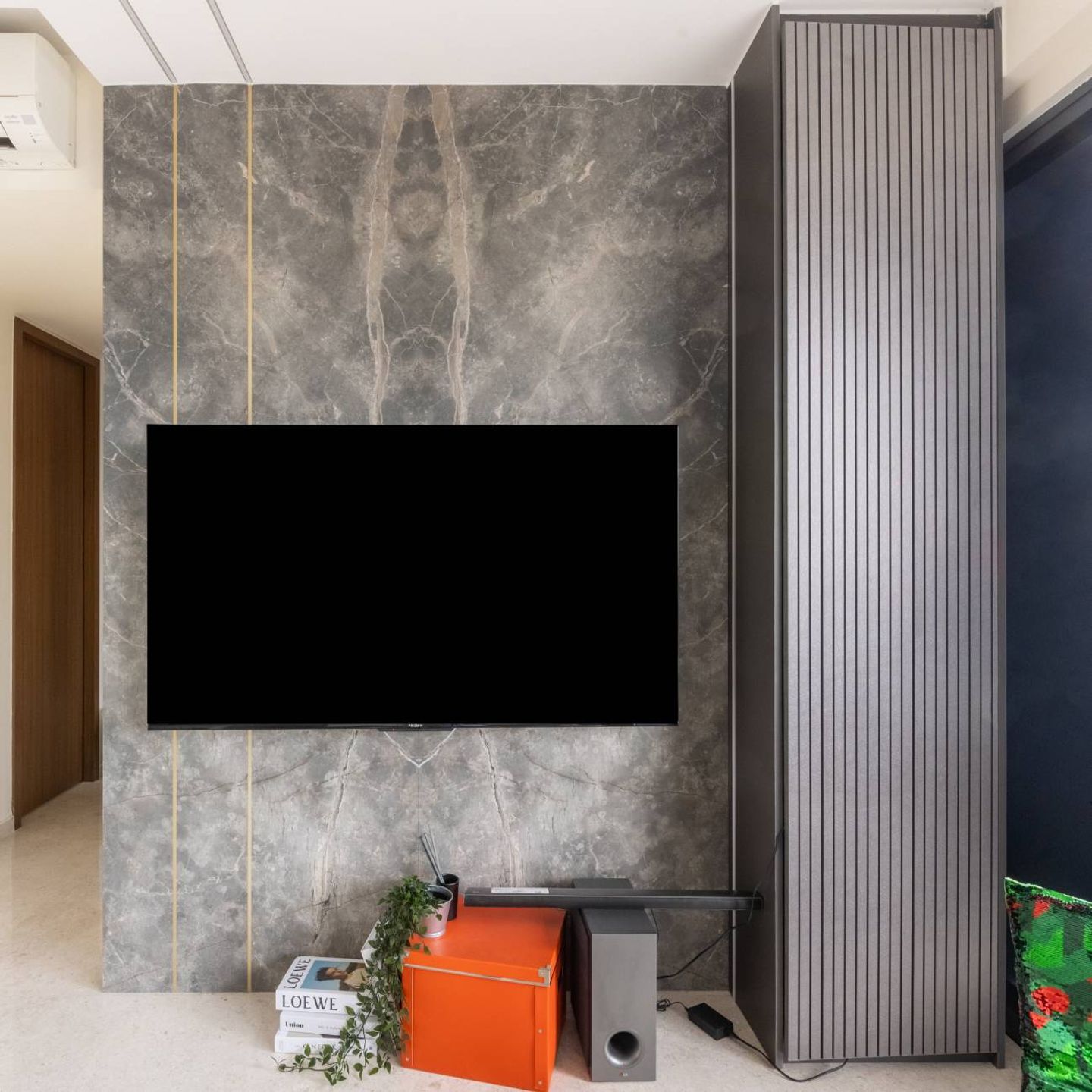Wall-Mounted Grey TV Cabinet Design With Matching Wall Cladding - Livspace