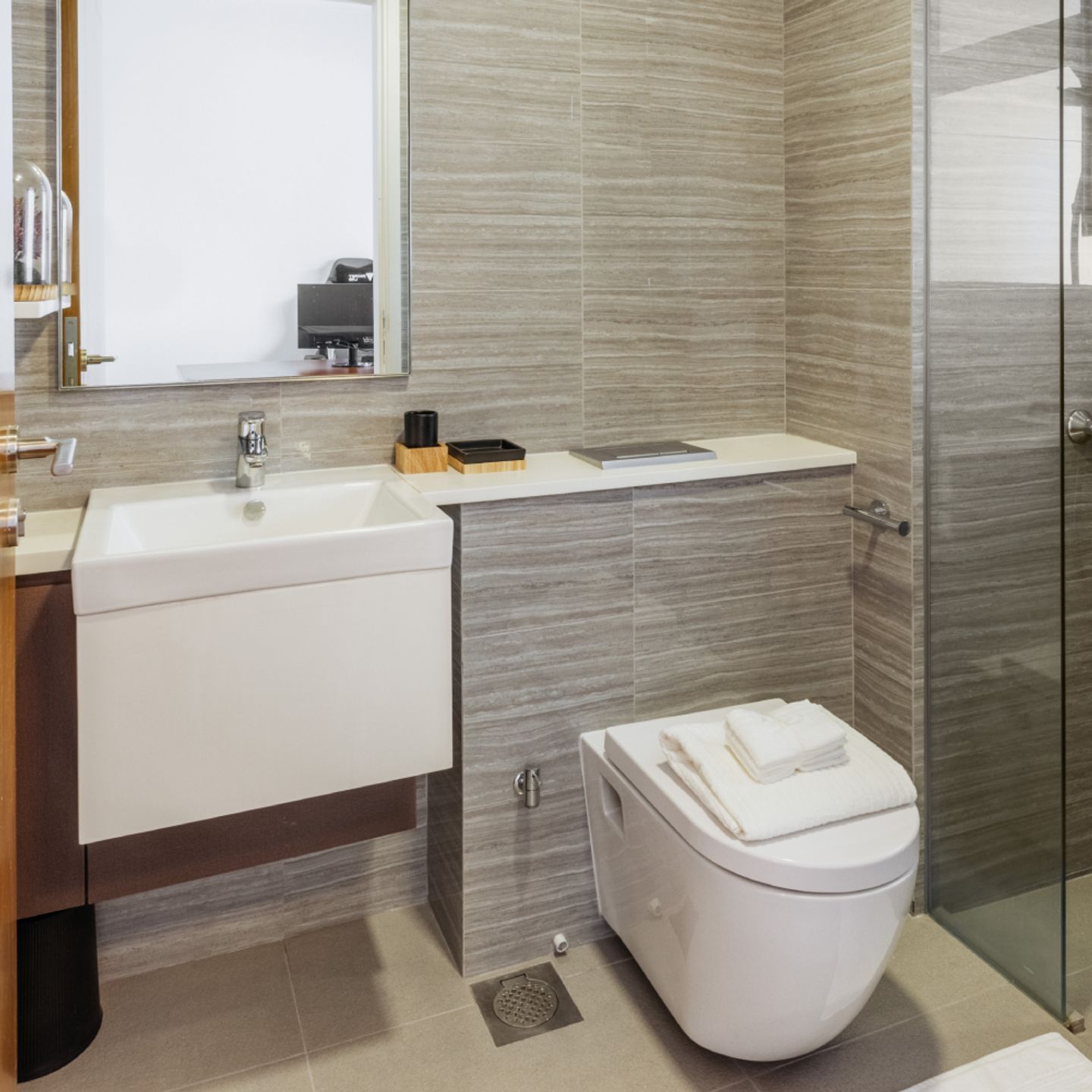 Modern White And Grey Bathroom Design With A Shower Cubicle