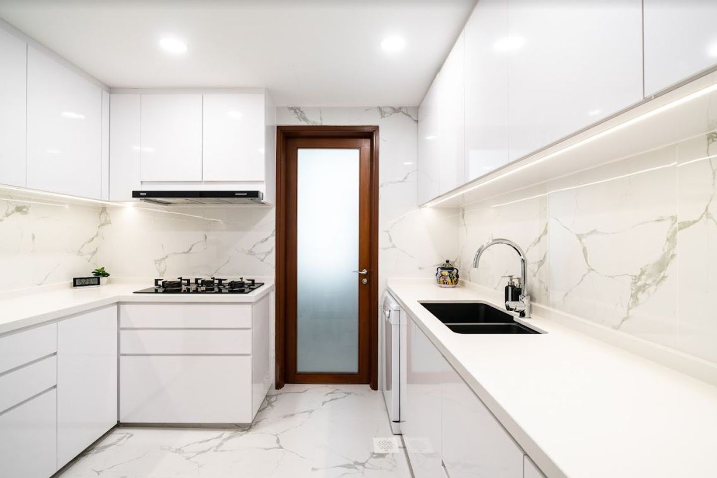 Minimal L-Shaped All-White Kitchen Design With Profile Handles