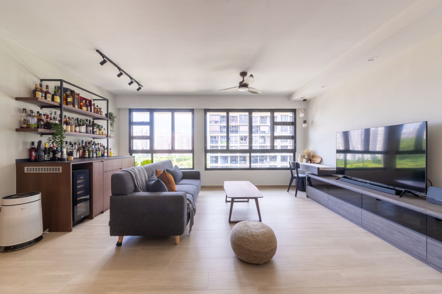 Cozy living room with leather sofa and brick accent wall - Livspace