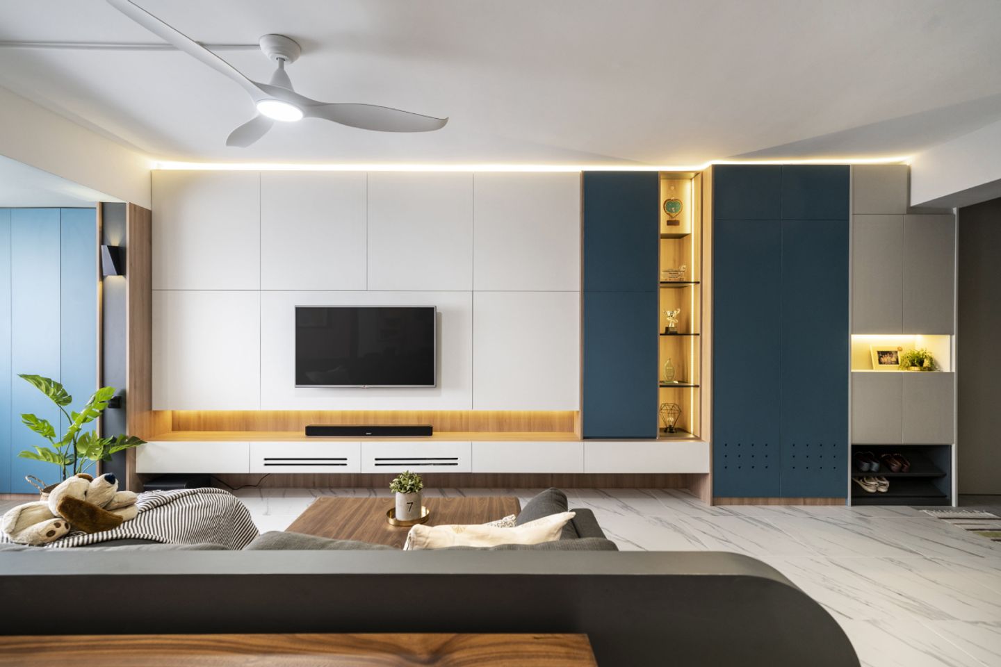 Living room with comfortable flush fabric sofa - Livspace