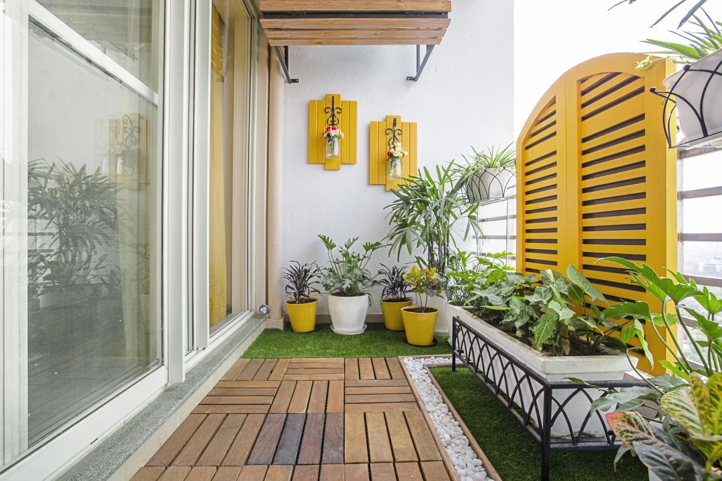10X7 Ft Balcony Design With Wooden And Yellow Accents - Livspace
