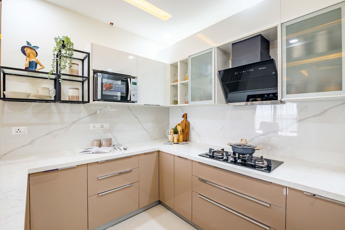 1. White Marble Kitchen Tile Design For Kitchen Backsplash - Livspace 2. Glossy White Marble Kitchen Tile Design For Kitchen With Breakfast Counter - Livspace