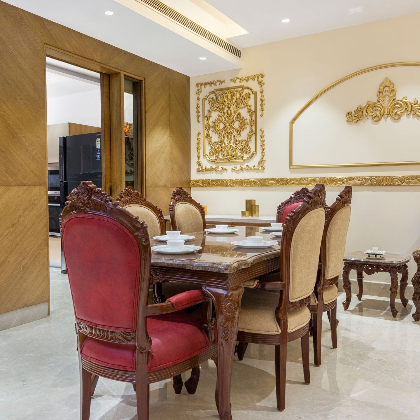 6-Seater Dining Room With Golden Wall Trims And Overhead Lights - Livspace