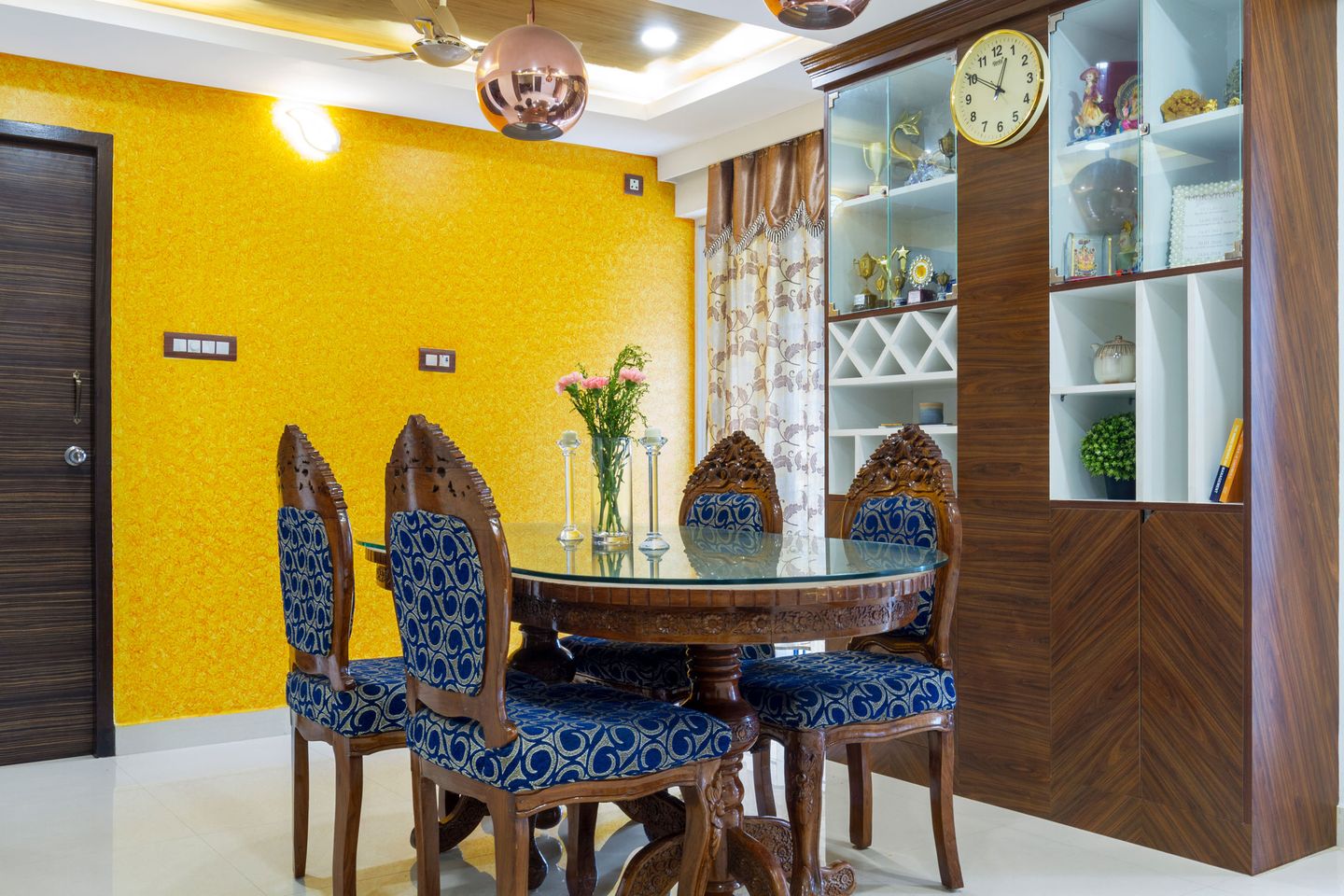 4-Seater Dining Room With With Blue Cushioned Chairs And Bright Yellow Wall Paint - Livspace