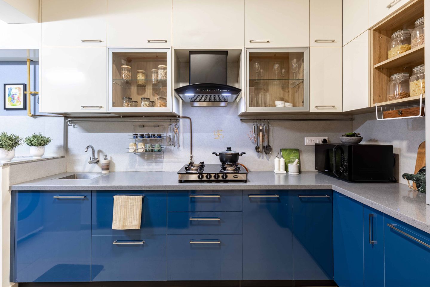 L-Shaped Blue And White Kitchen With Grey Countertop - Livspace