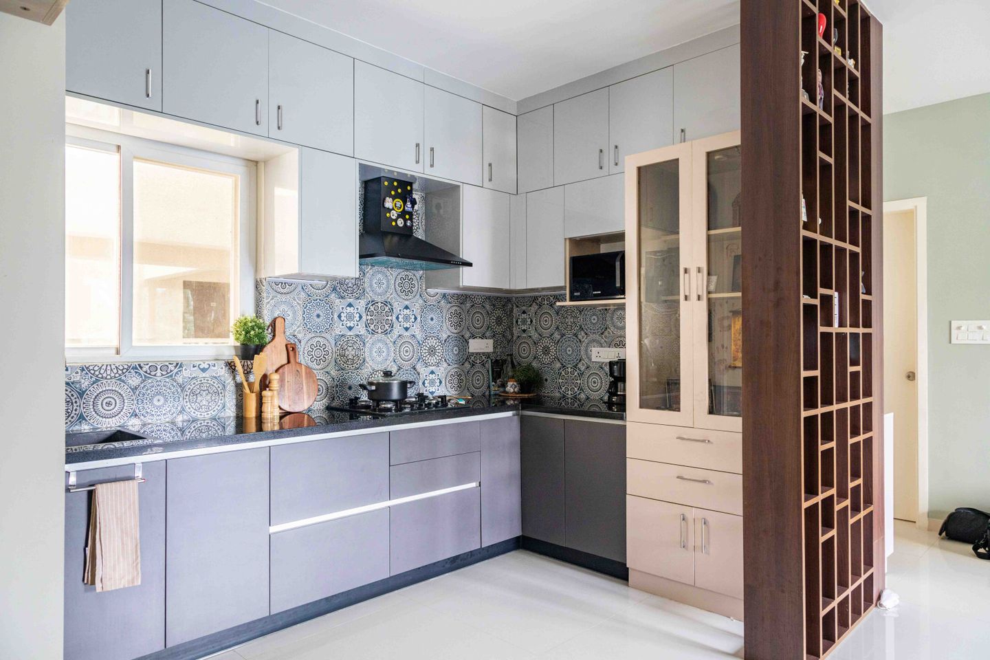 L-Shaped Blue And Grey Kitchen Design With Moroccan Backsplash - Livspace