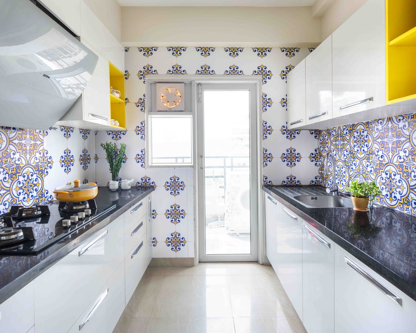 White Parallel Kitchen Design With Geometric Backsplash - Livspace