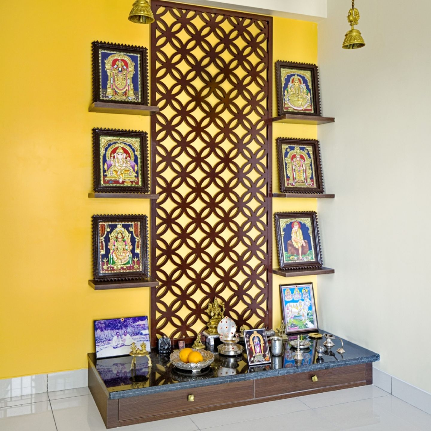 Traditional Floor-Mounted Mandir Unit With CNC-Cut Wooden Panel And Yellow Accent Wall