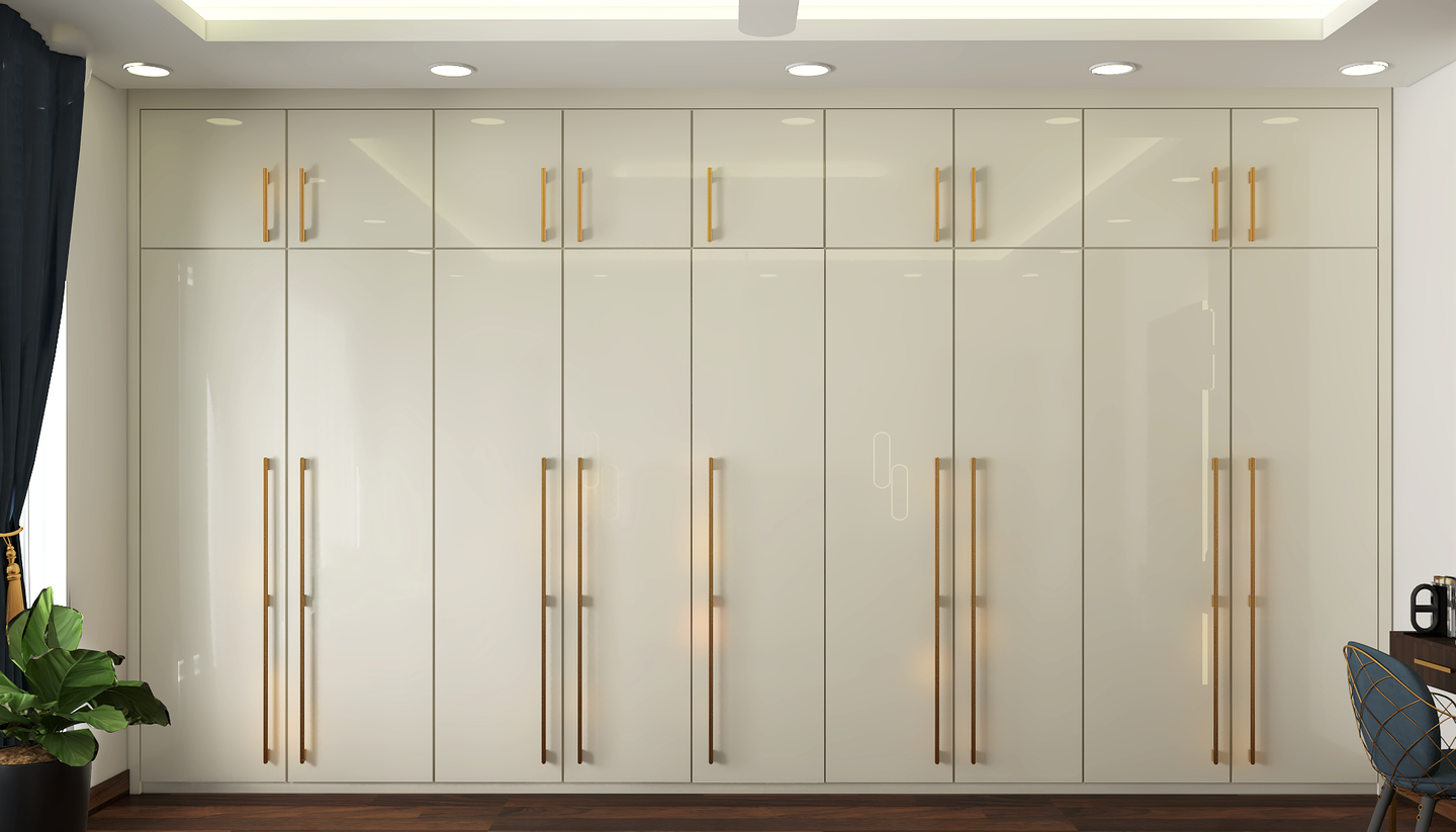 Glossy Finish Classic Wardrobe Design With Golden Handles - Livspace