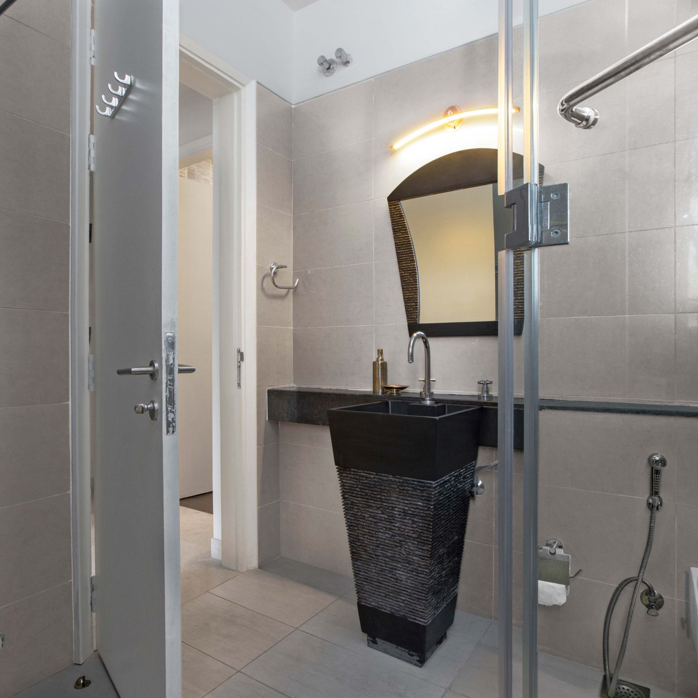 Compact Bathroom Design With Beige Tiles - Livspace