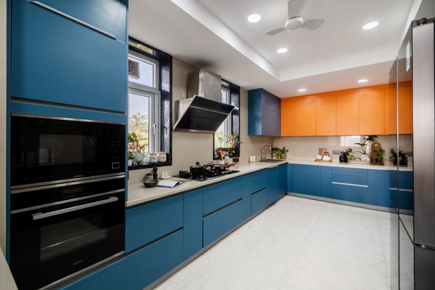 U-Shaped Kitchen Design With White Flooring - Livspace