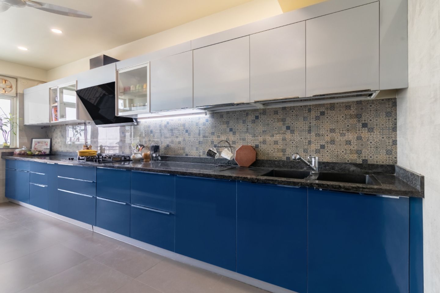 Modern Parallel Kitchen Cabinet Design With A Wide Blue Base Unit With Drawers