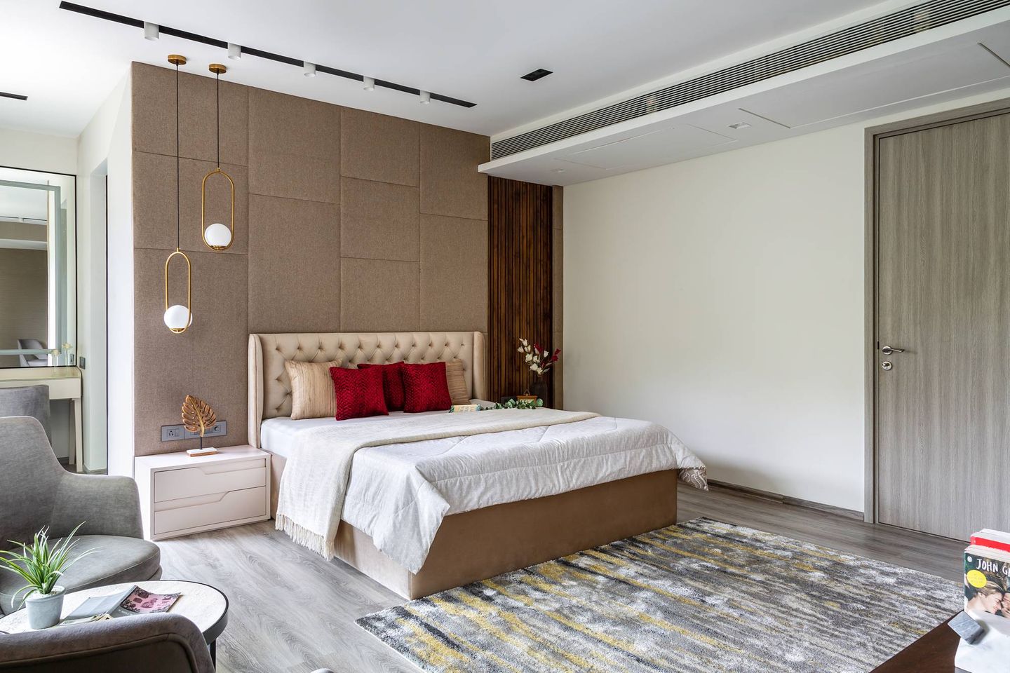 Modern Bedroom Design With A Beige Upholstered Bed And Matching Side Table With Drawers - Livspace