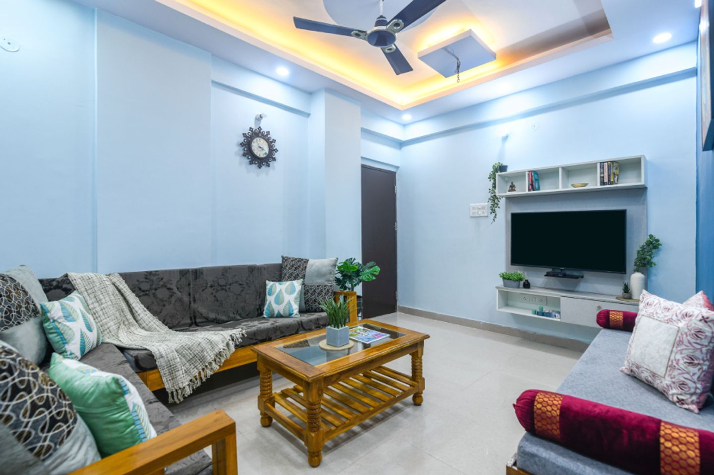 Light Blue Wall Paint Design With Photo Frames | Livspace