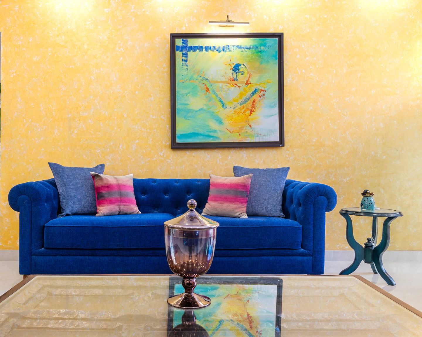 Textured Yellow Wallpaper Design With A Large Framed Painting - Livspace